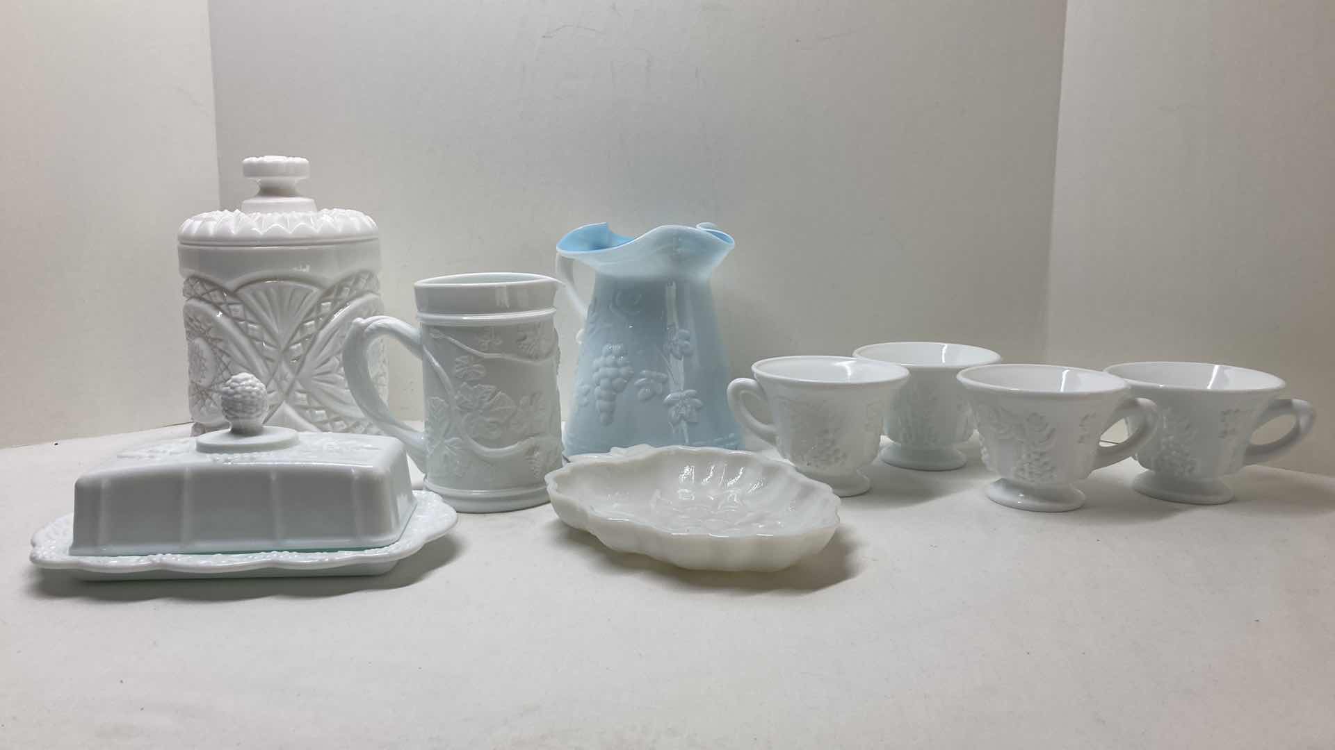 Photo 2 of MILK GLASS GRAPEVINE TEA CUP SET (4) MILK GLASS COOKIE JAR & SERVING DISHES- VARIOUS DESIGNS (4)