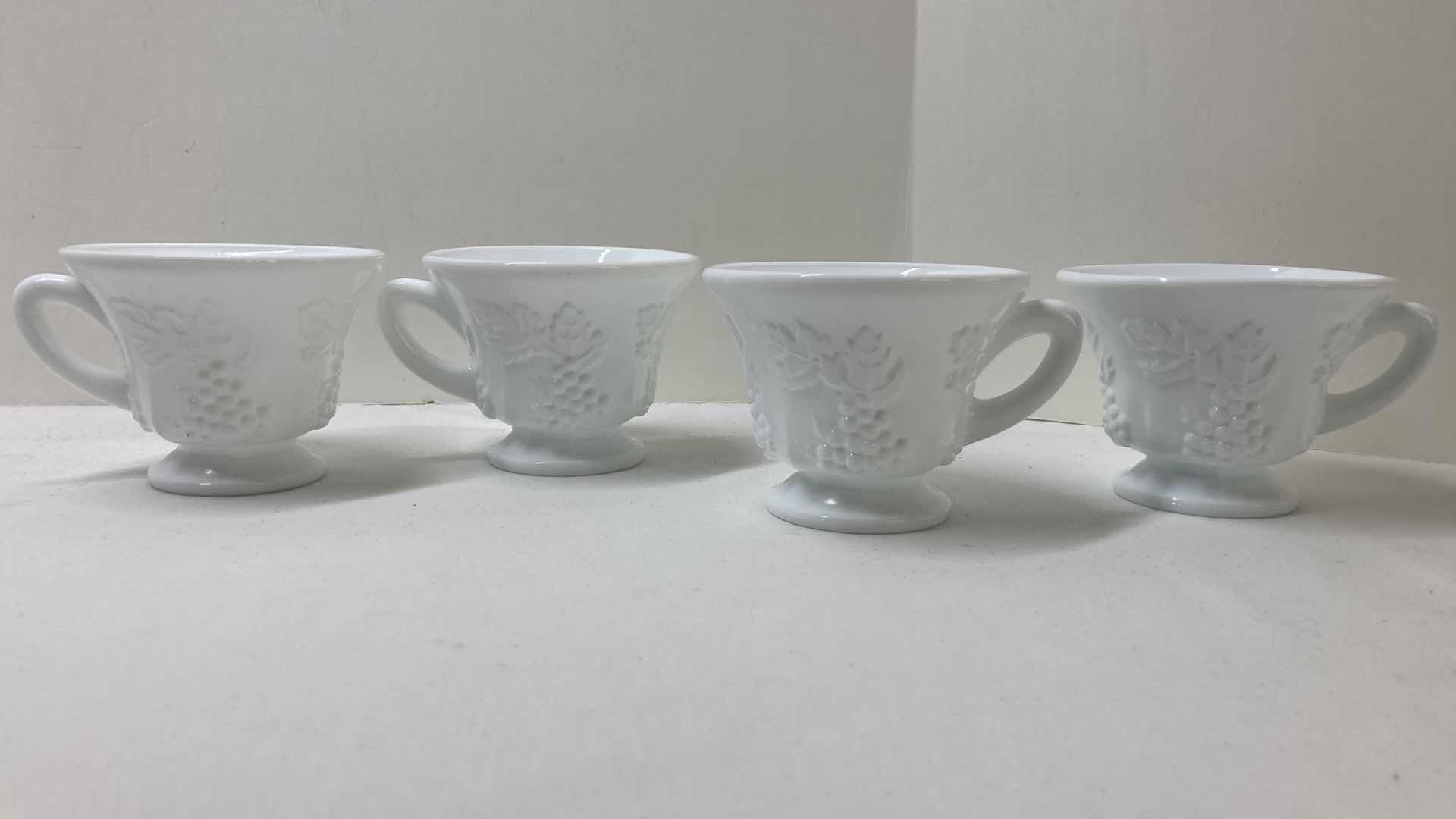 Photo 1 of MILK GLASS GRAPEVINE TEA CUP SET (4) MILK GLASS COOKIE JAR & SERVING DISHES- VARIOUS DESIGNS (4)
