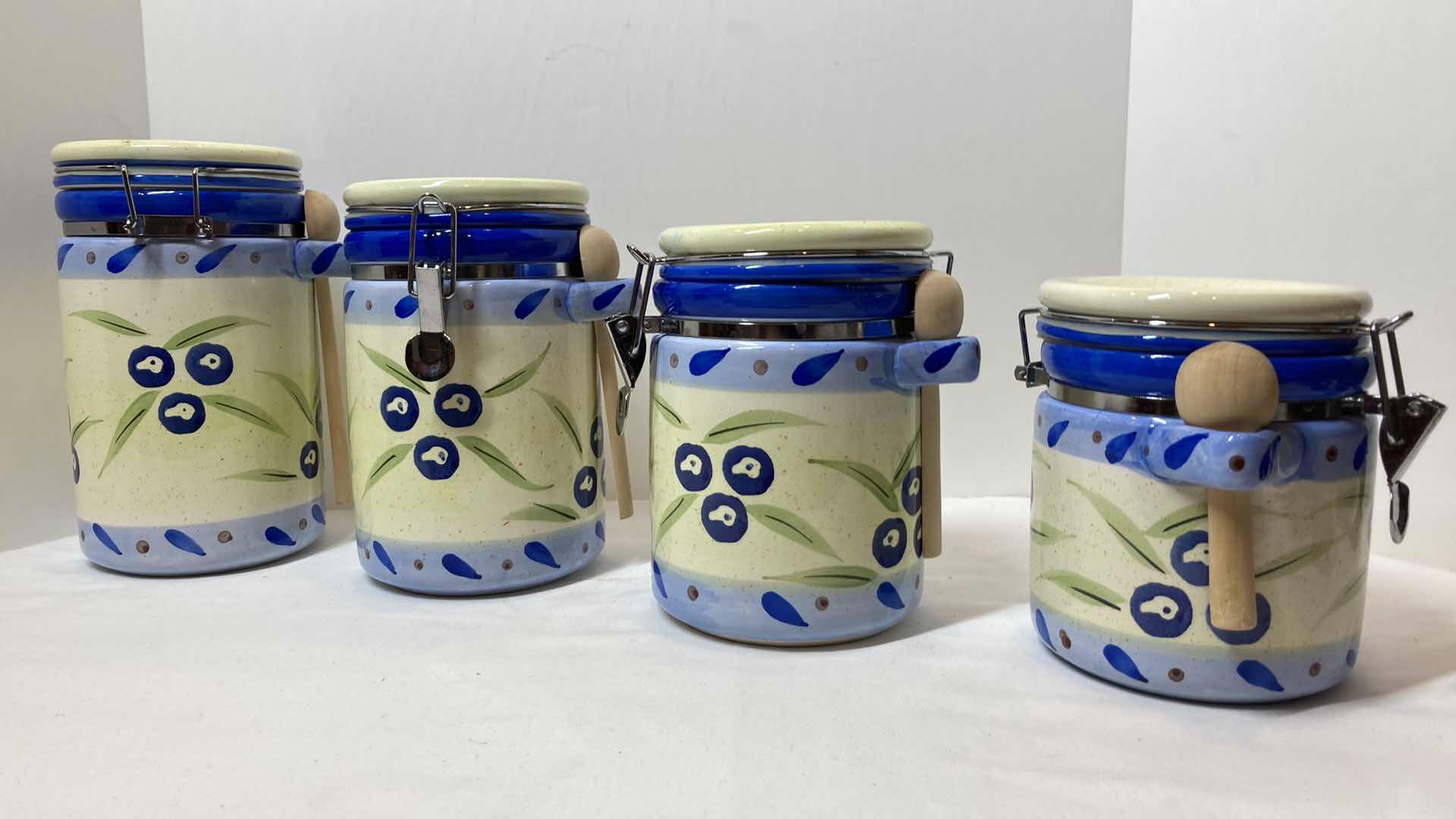 Photo 1 of METRO MARKETING ITALIAN ART STYLE CERAMIC DRY STORAGE CANISTERS W WOOD SPOONS (4)