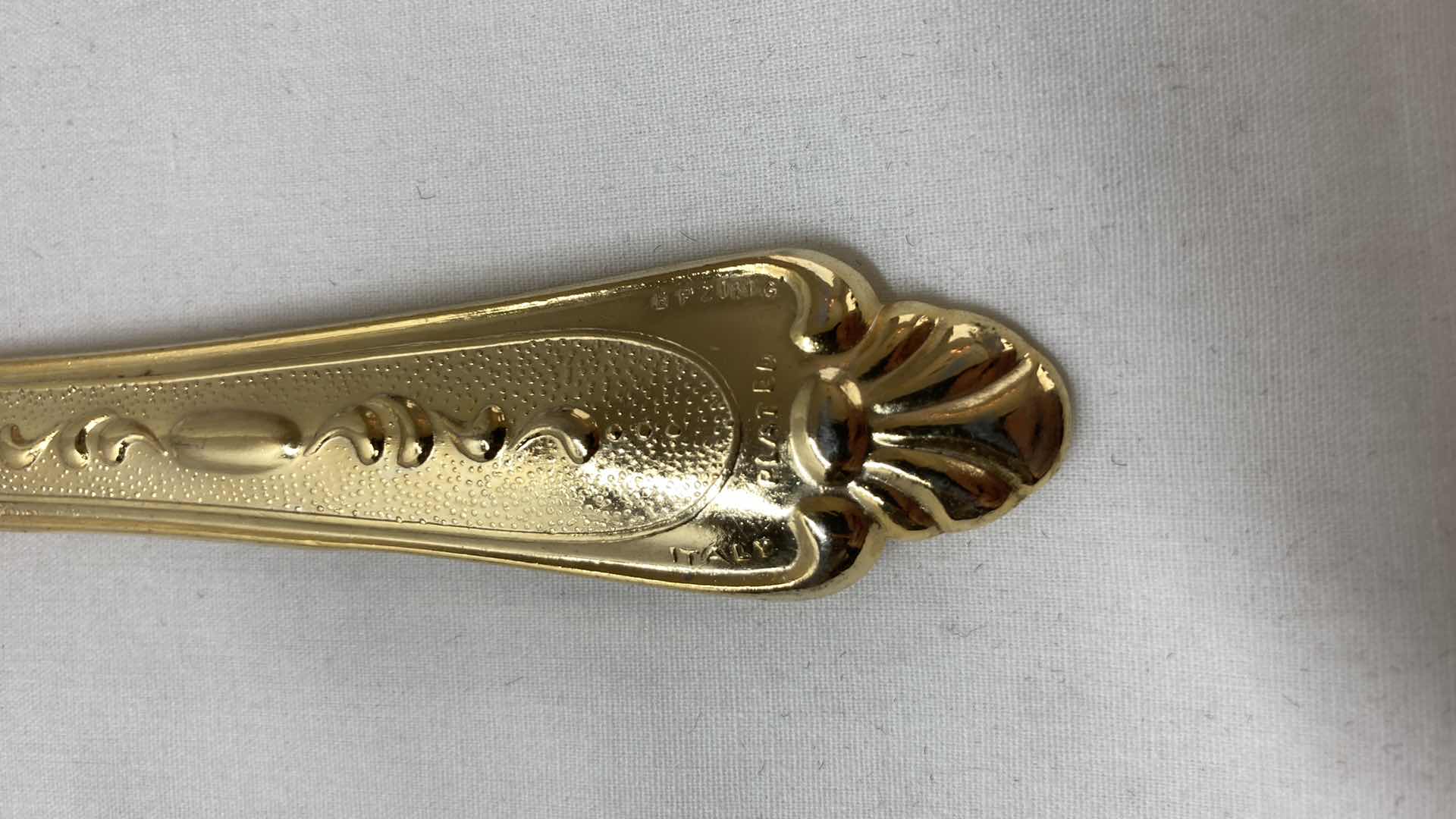 Photo 1 of LBL ITALY GOLD FINISH EP ZINC PLATED FLATWARE (36) W VARIOUS GOLD FINISH SERVING WARE (2) & FLATWARE RACK