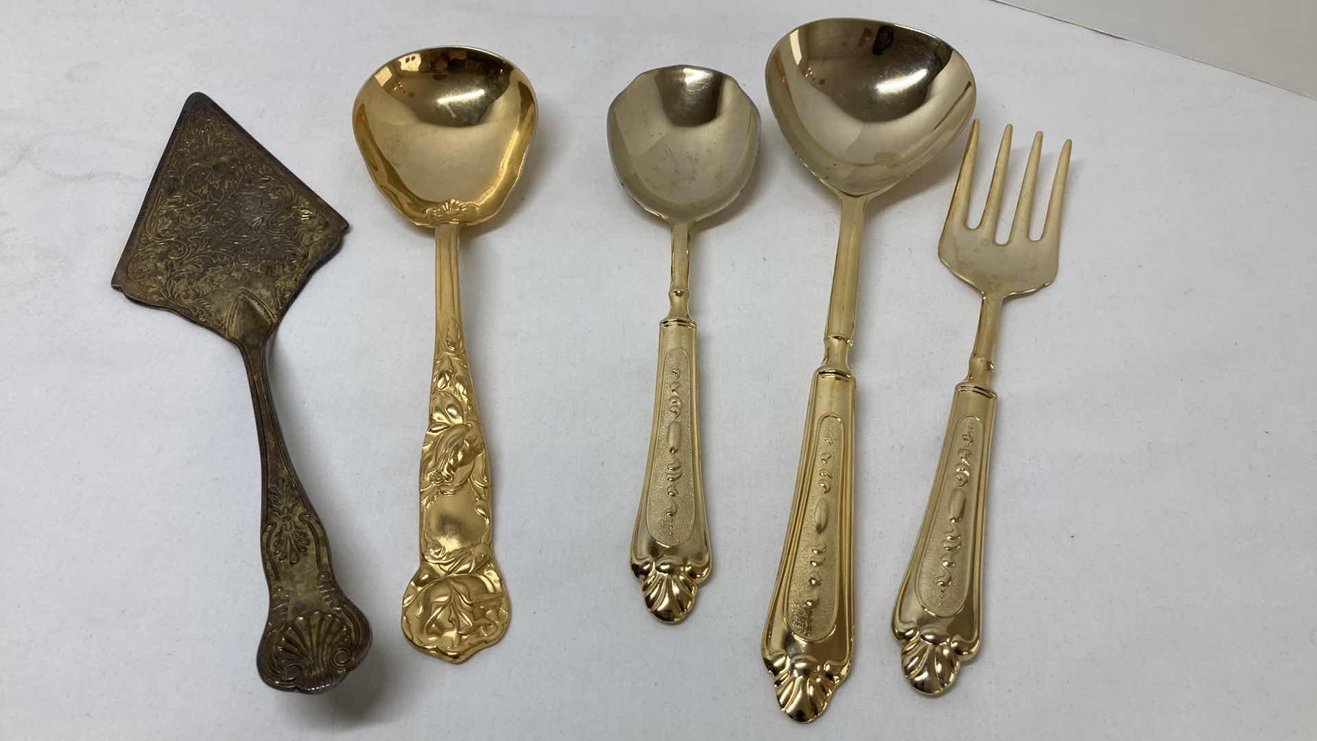 Photo 1 of LBL ITALY GOLD FINISH EP ZINC PLATED FLATWARE (36) W VARIOUS GOLD FINISH SERVING WARE (2) & FLATWARE RACK