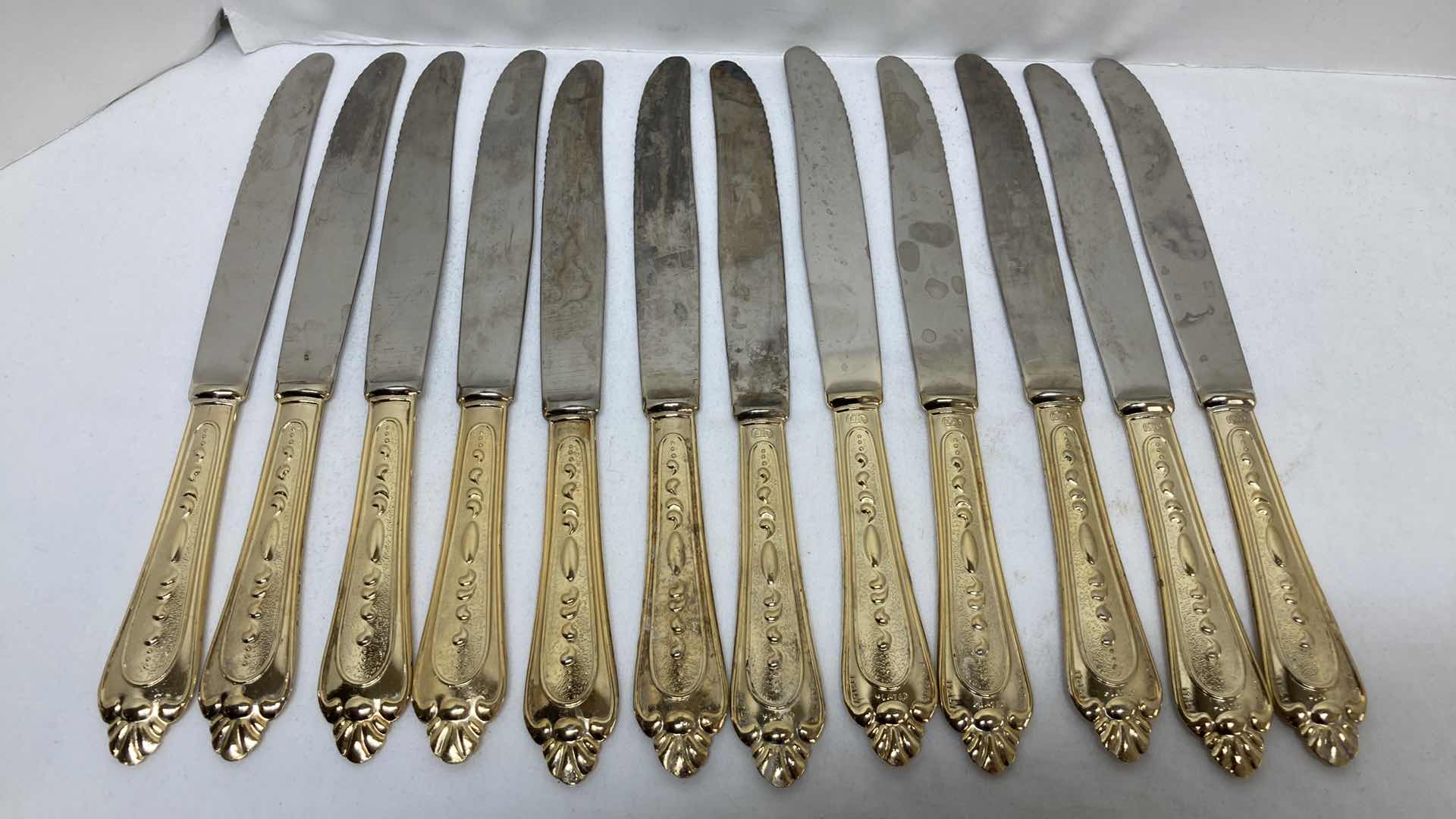 Photo 1 of LBL ITALY GOLD FINISH EP ZINC PLATED FLATWARE (36) W VARIOUS GOLD FINISH SERVING WARE (2) & FLATWARE RACK