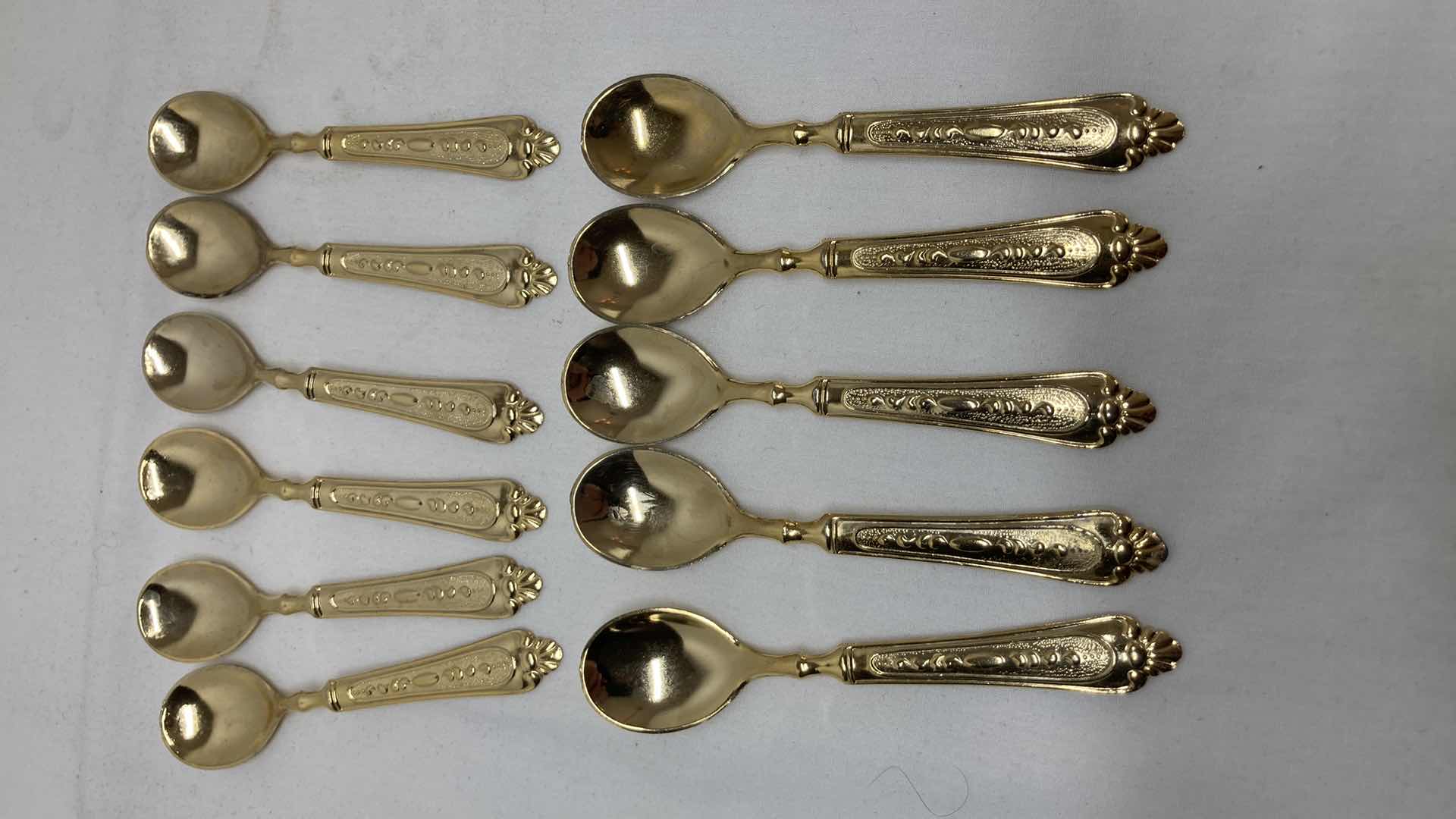 Photo 1 of LBL ITALY GOLD FINISH EP ZINC PLATED FLATWARE (36) W VARIOUS GOLD FINISH SERVING WARE (2) & FLATWARE RACK