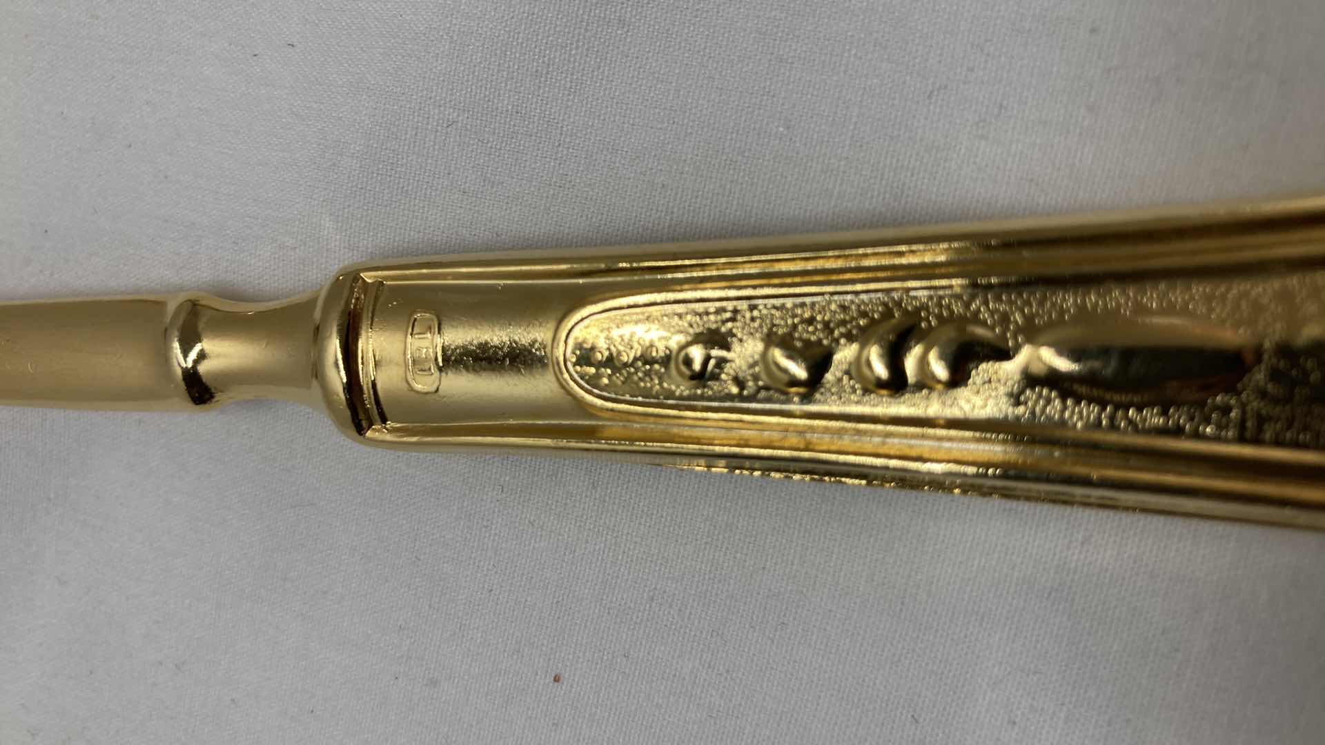 Photo 1 of LBL ITALY GOLD FINISH EP ZINC PLATED FLATWARE (36) W VARIOUS GOLD FINISH SERVING WARE (2) & FLATWARE RACK