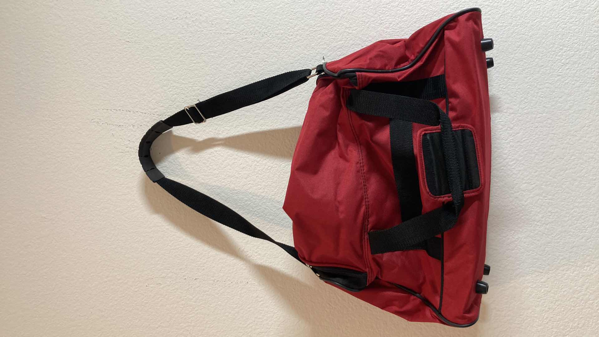 Photo 1 of AMERICAN TOURISTER RED DUFFEL BAG
