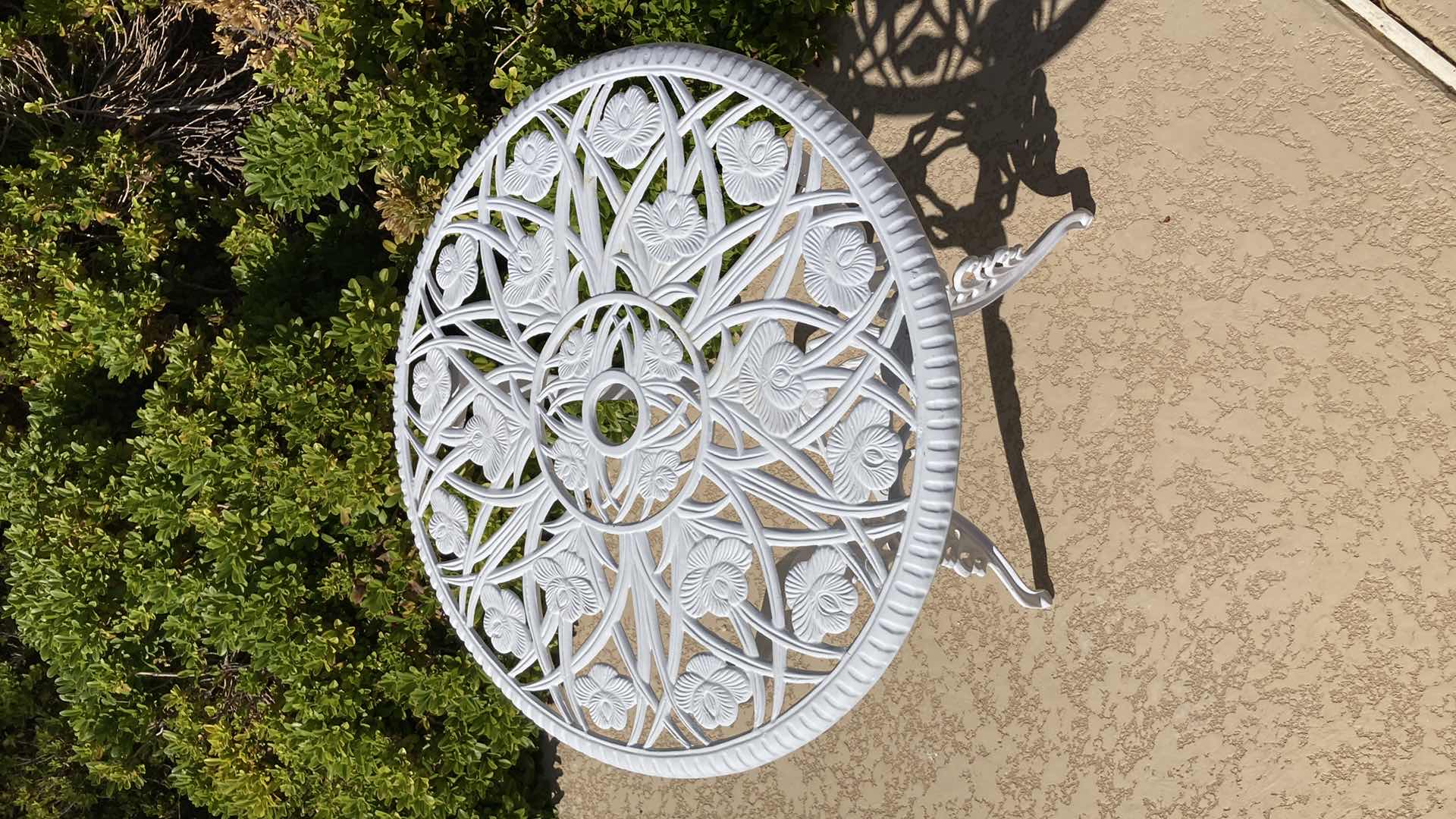 Photo 2 of ORNATE FLORAL PATTERN ROUND PATIO TABLE 24” X 26”