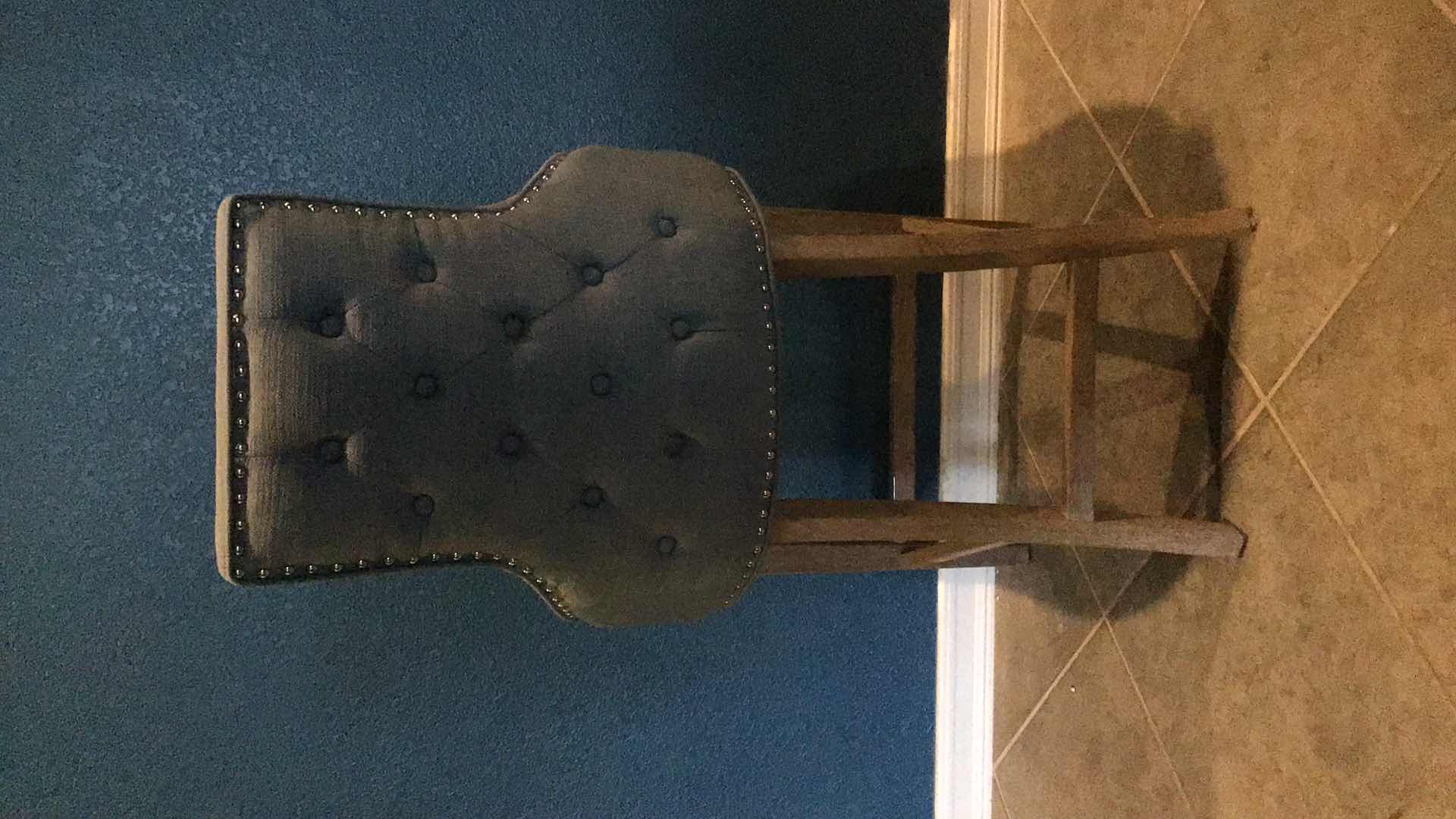 Photo 1 of RIVETED BLUE FABRIC AND WOOD LEGGED COUNTER/BARSTOOL 23” X 23” H43”