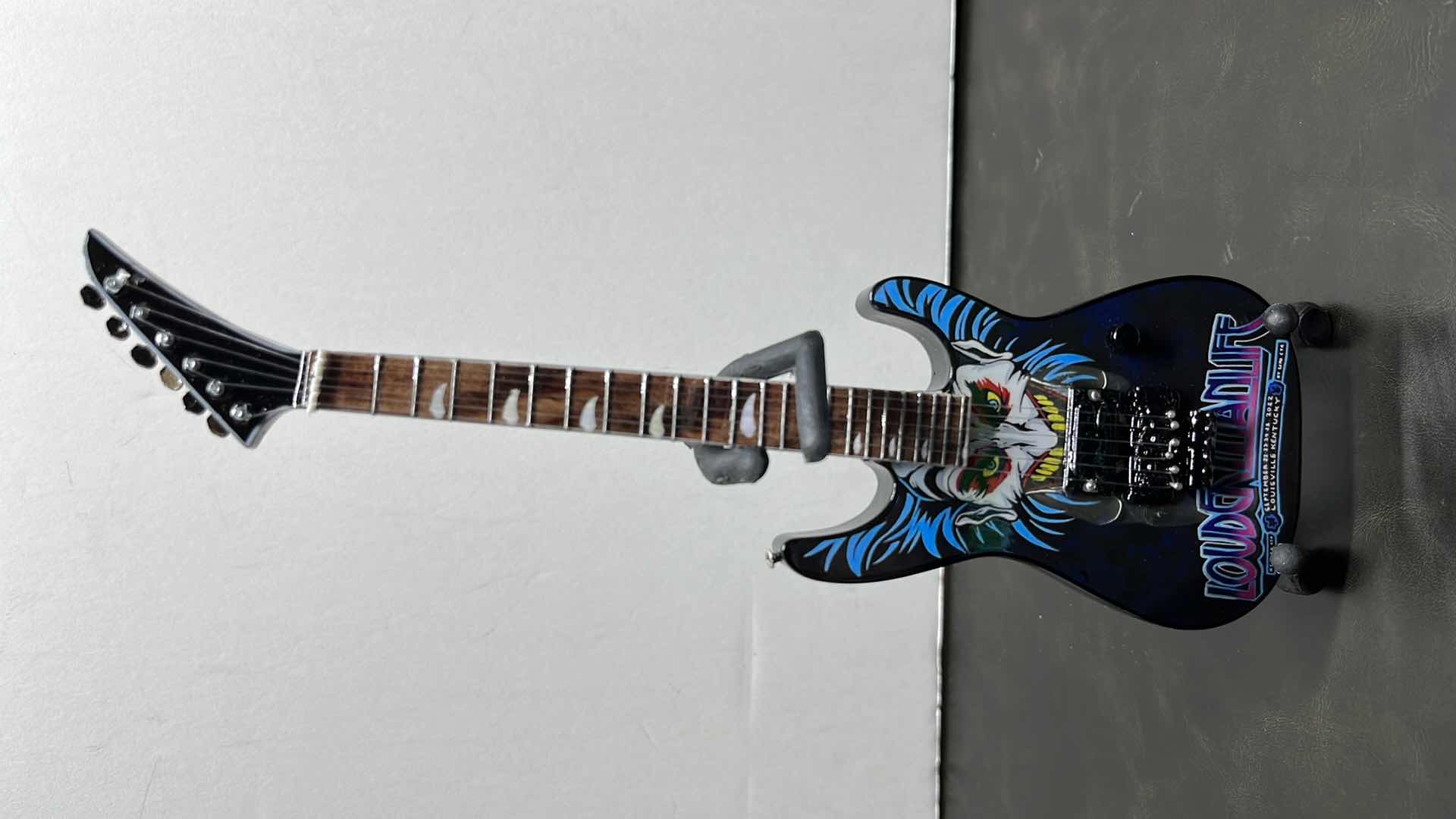 Photo 1 of RONZ WORLD AXE HEAVEN LOUDER THAN LIFE 2022 MINIATURE GUITAR W STAND IN ORIGINAL BOX,  3” X .75” H10”