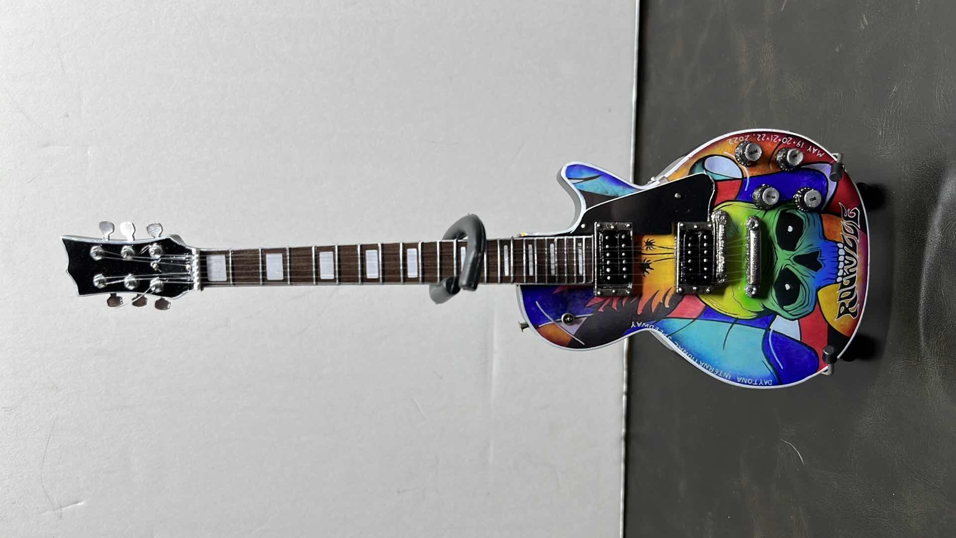 Photo 1 of RONZ WORLD AXE HEAVENWELCOME TO ROCKVILLE 2022 MINIATURE GUITAR W STAND IN ORIGINAL BOX,  3.25 ” X .75” H10”
