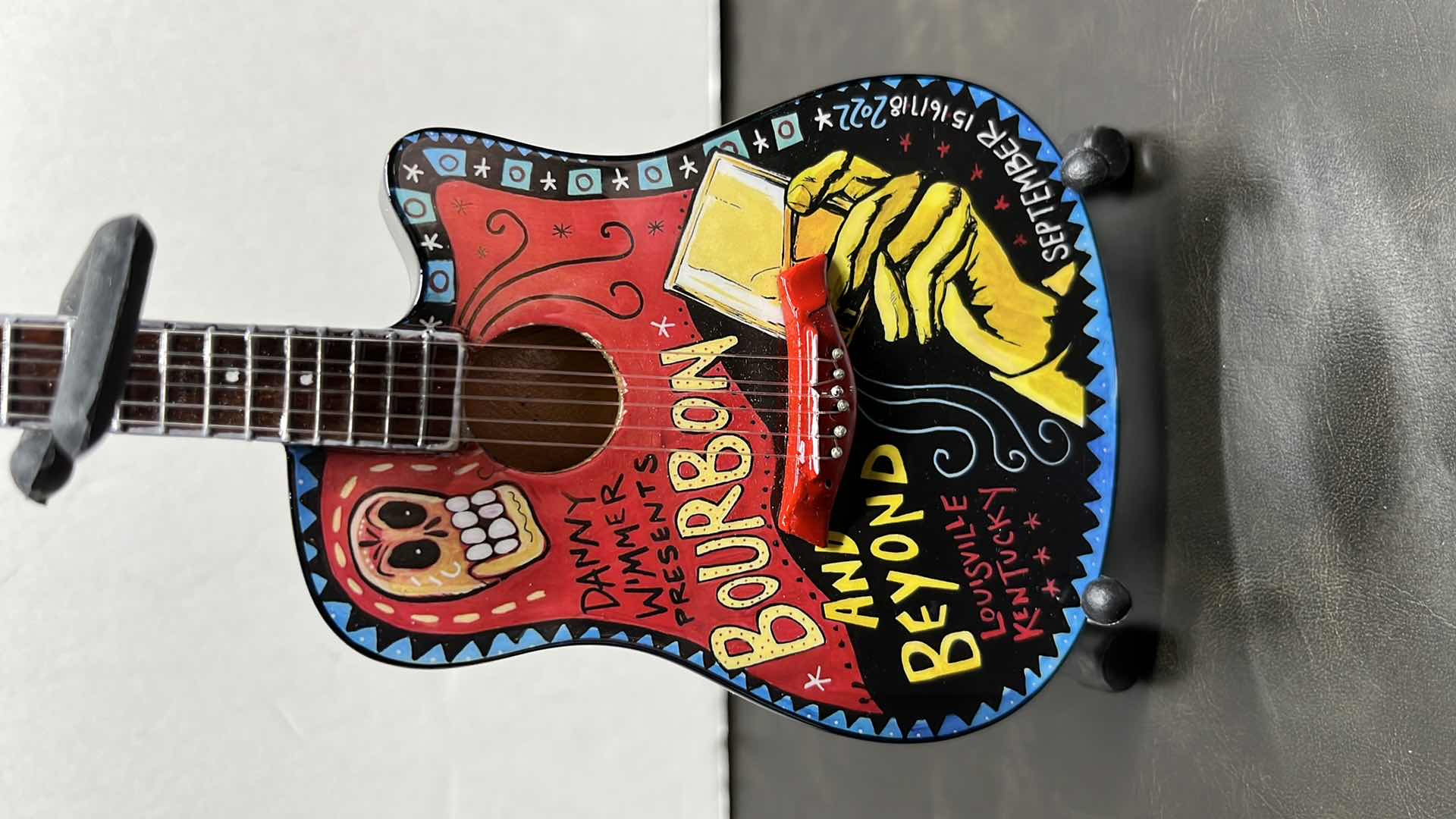 View 2 of RONZ WORLD AXE HEAVEN BOURBON & BEYOND 2022 MINIATURE GUITAR W STAND IN ORIGINAL BOX,  3.75” X 1” H10”