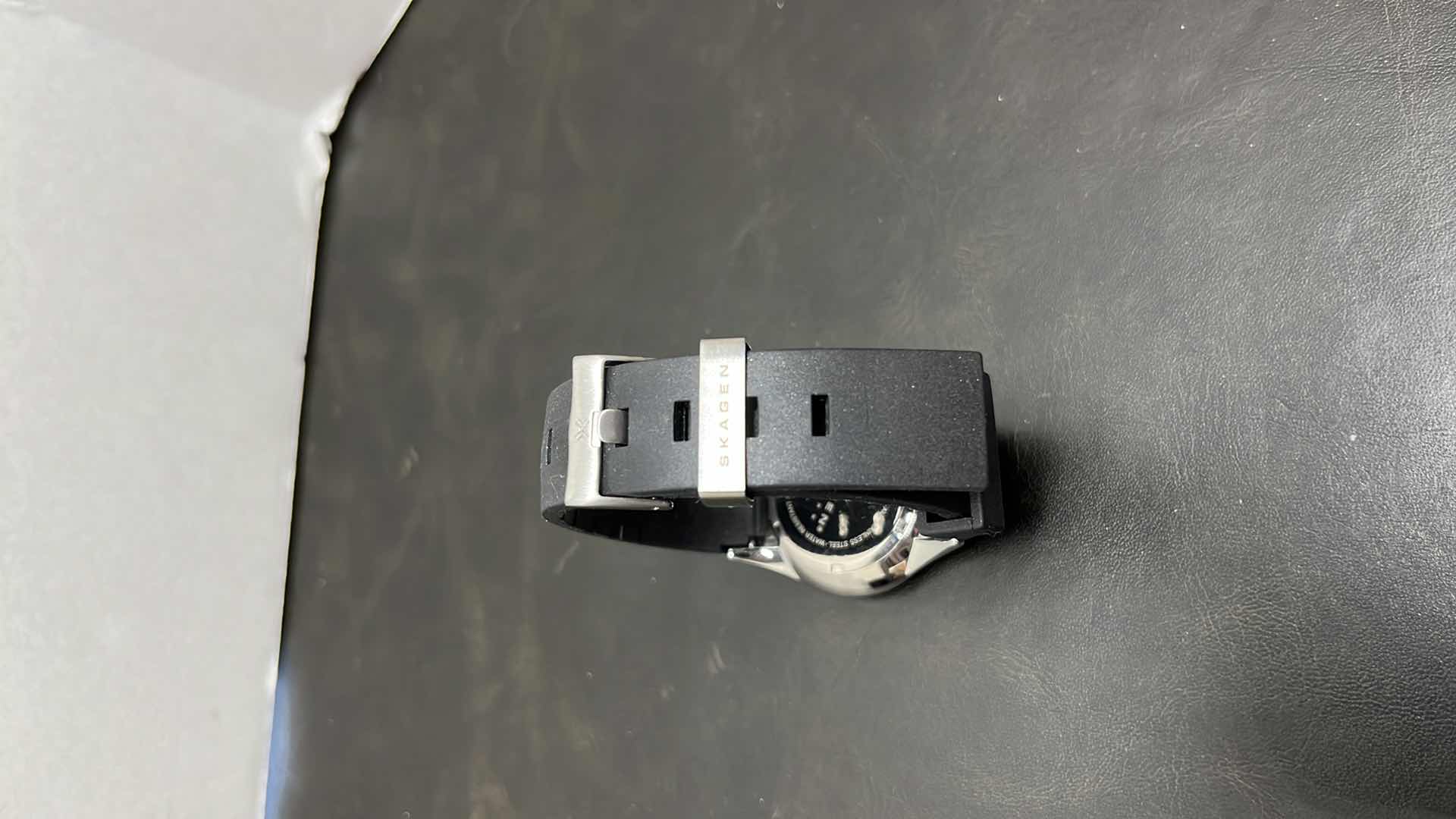 Photo 1 of MENS SKAGEN DENMARK STAINLESS STEEL CASE MULTIFUNCTION WATCH W RUBBER STRAP, BLACK DIAL W ROSE GOLD INDICATORS IN ORIGINAL BOX, MODEL 377LSRBO