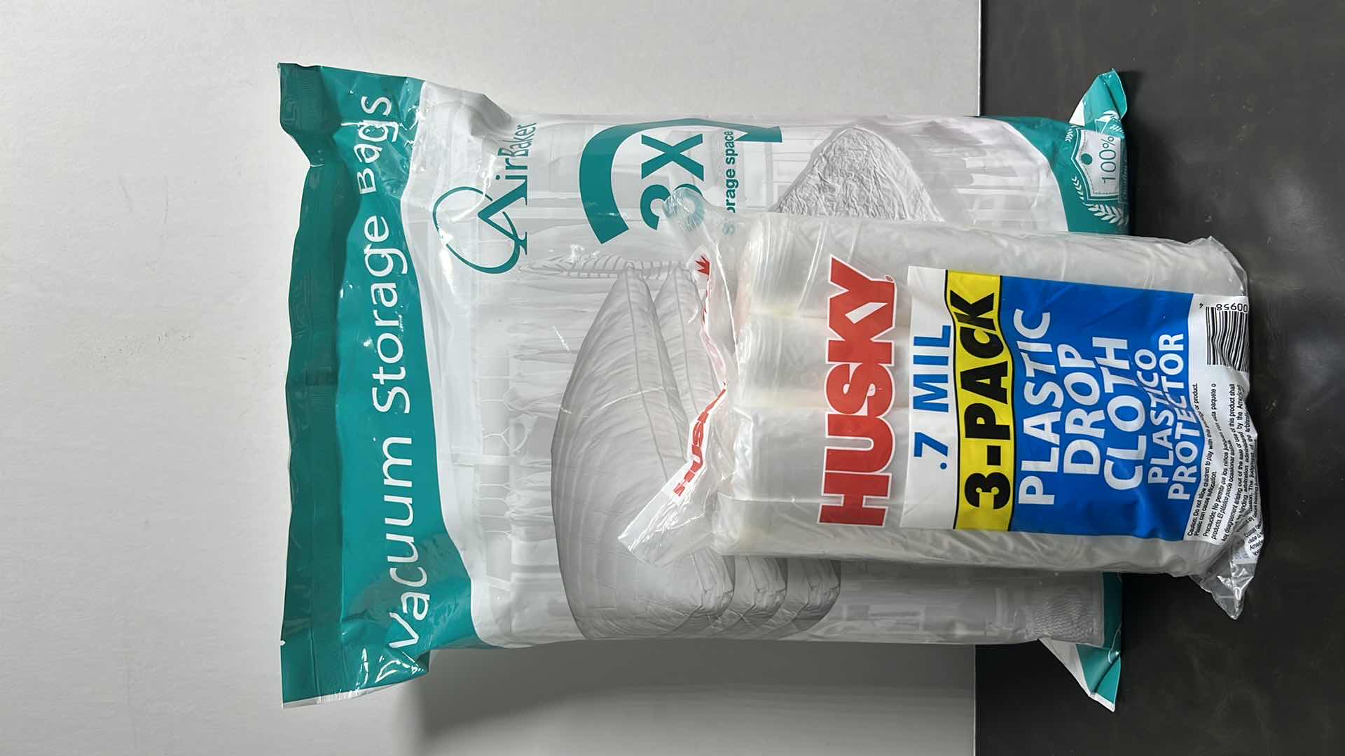 Photo 1 of NEW AIRBAKER JUMBO VACUUM STORAGE BAGS (6) & HUSKY 0.7 MIL PLASTIC DROP CLOTH 3-PACK
