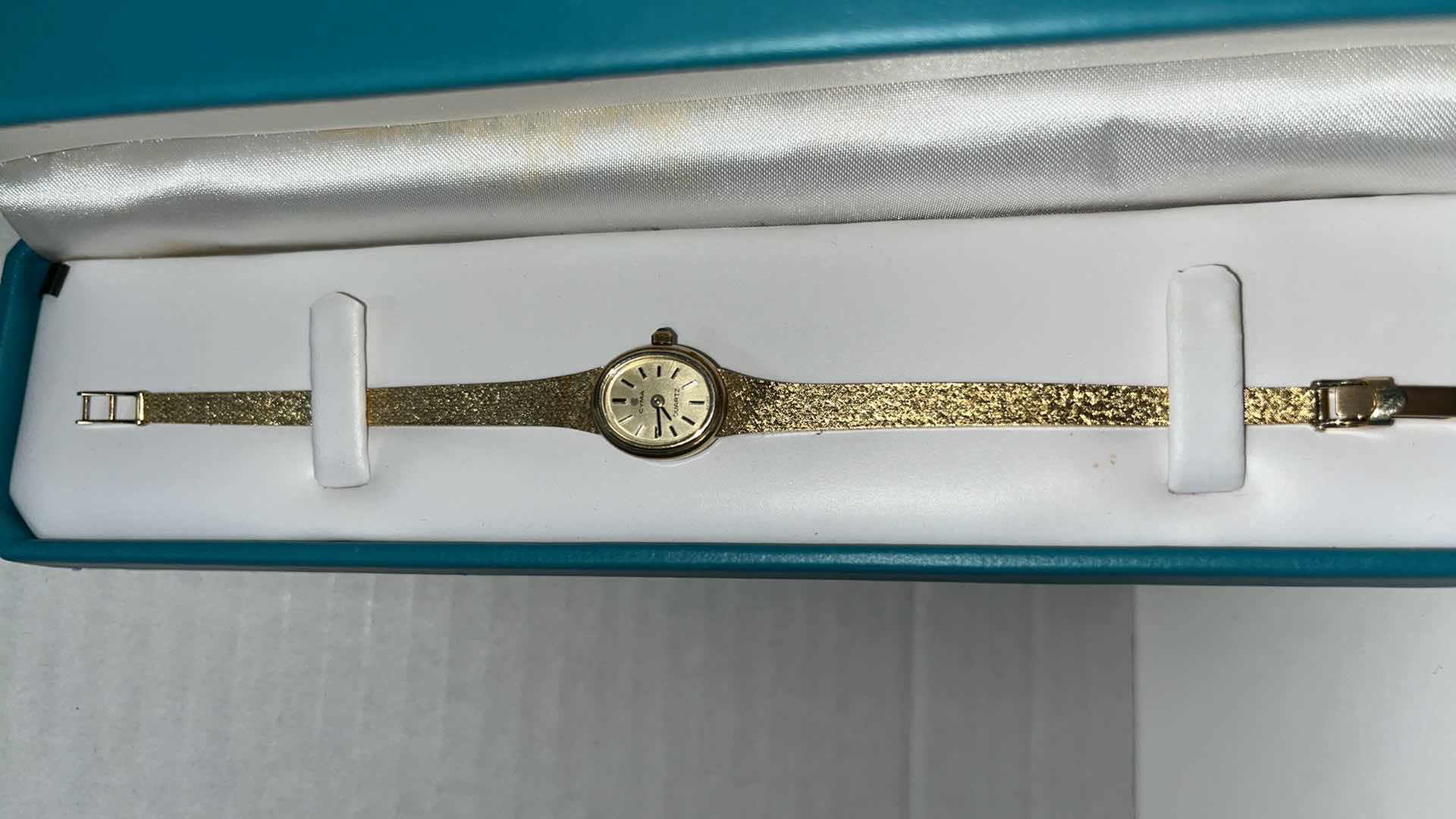 Photo 1 of CYMA LADIES 14K YELLOW GOLD QUARTZ WATCH W OVAL CHAMPAGNE DIAL & 14K SOLID GOLD MESH BRACELET .25” X 6.75”