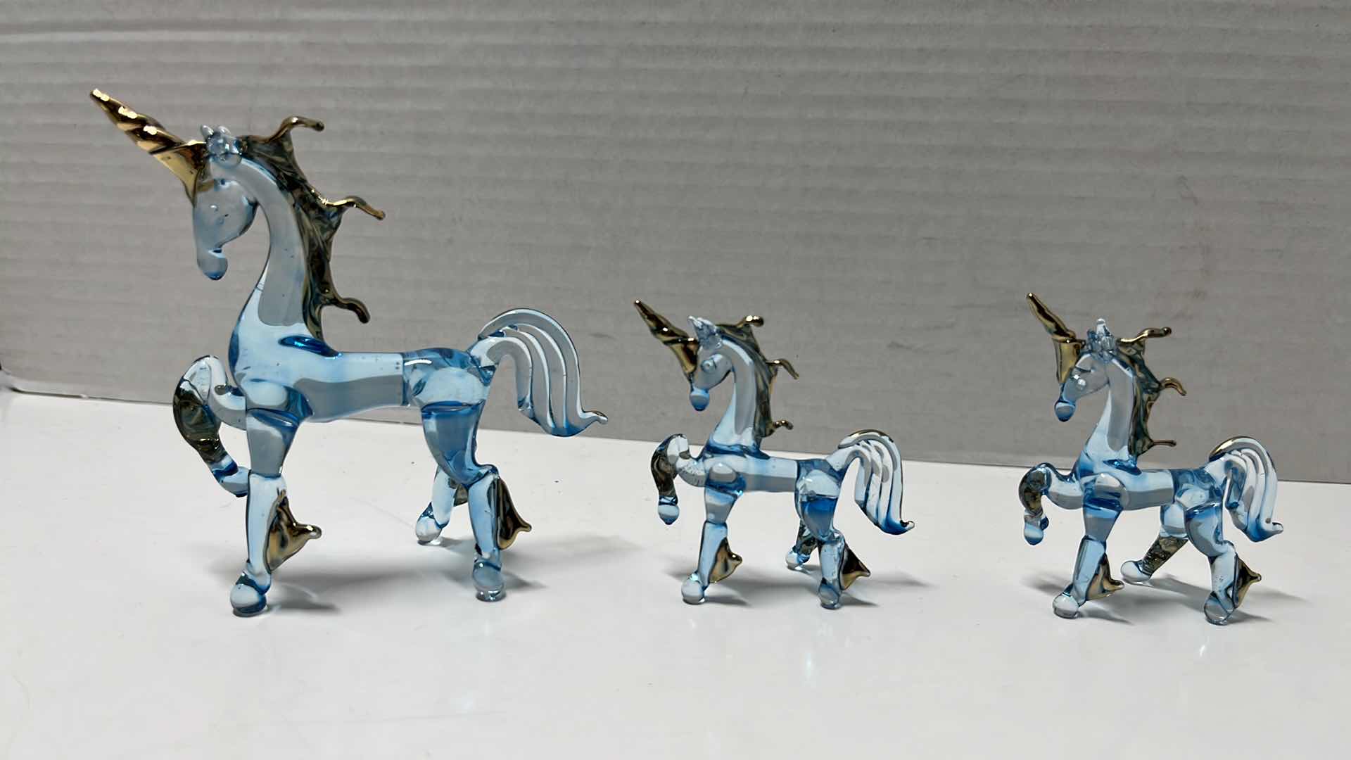 Photo 2 of HAND BLOWN CLEAR BLUE GLASS UNICORNS W GOLD ACCENTS & MIRRORED HAND BLOWN UNICORNS (5)
