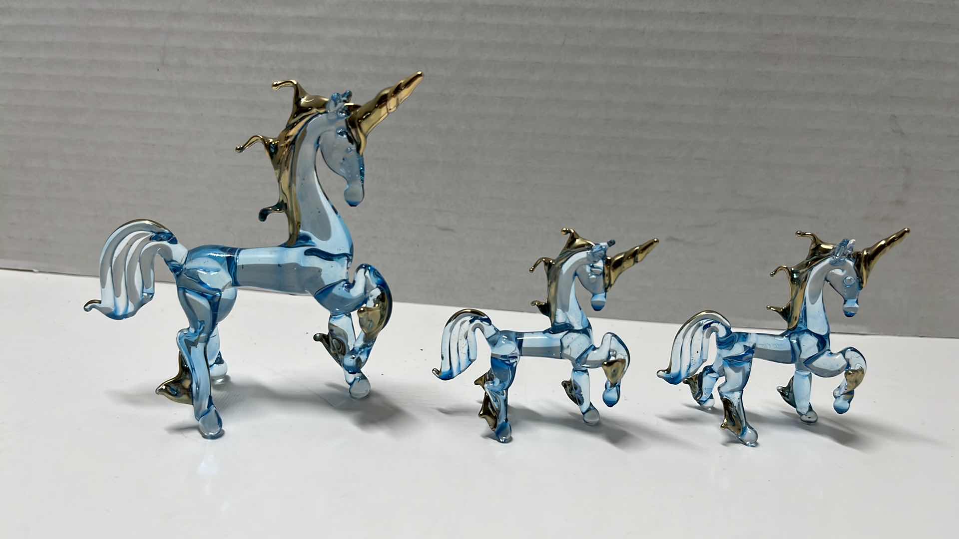 Photo 3 of HAND BLOWN CLEAR BLUE GLASS UNICORNS W GOLD ACCENTS & MIRRORED HAND BLOWN UNICORNS (5)