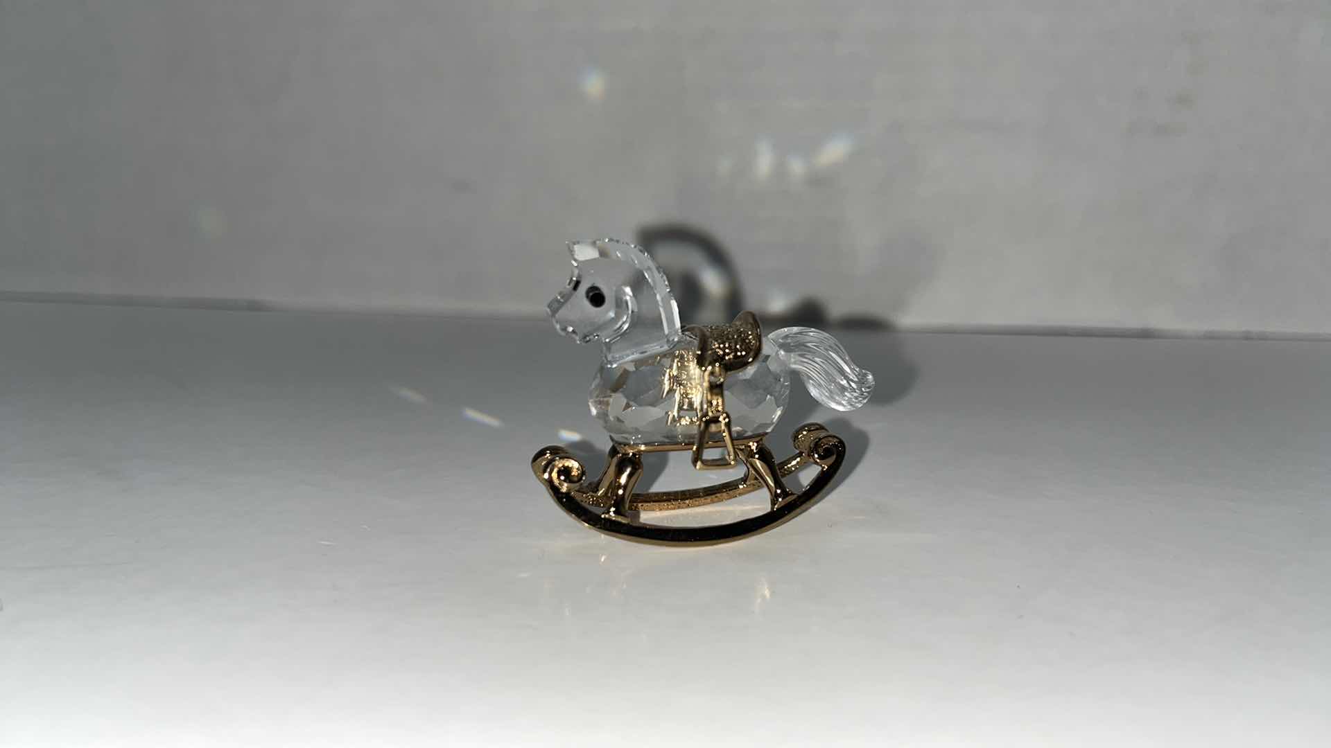 Photo 1 of HAND BLOWN CLEAR GLASS ROCKING UNICORN W GOLD ACCENTS 4.75” X 2” H4”W CRYSTAL ROCKING HORSE W GOLD ACCENTS (2)