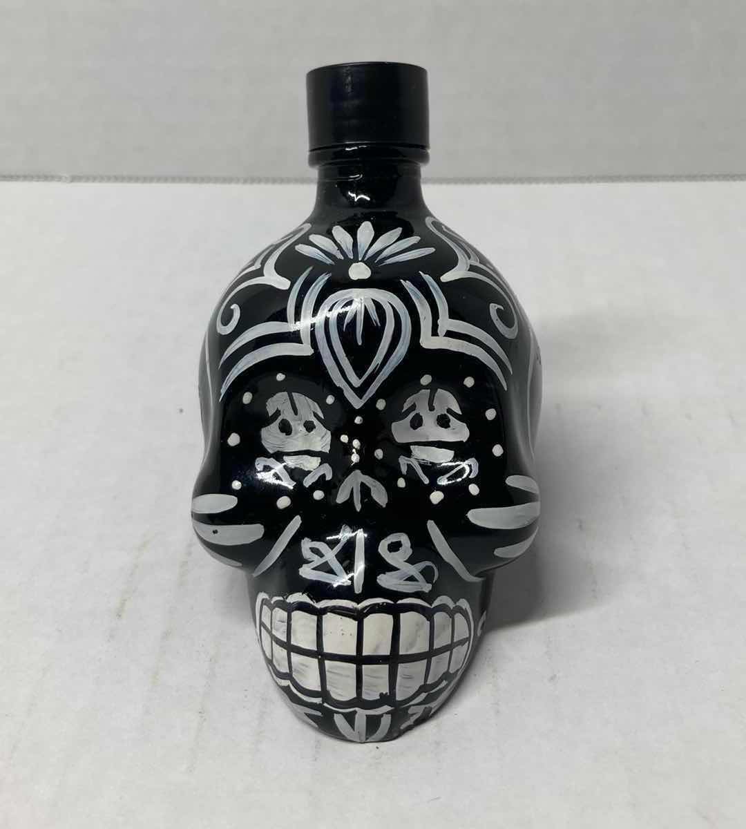 Photo 1 of LOS CABOS GLASS REVOLVER LIQUOR BOTTLE & KAH GLASS SKULL LIQUOR BOTTLE