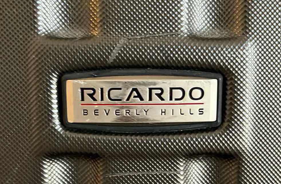 Photo 1 of RICARDO ROLLING LUGGAGE CHECK BAG W BOSS TRAVEL CARRYON BAG