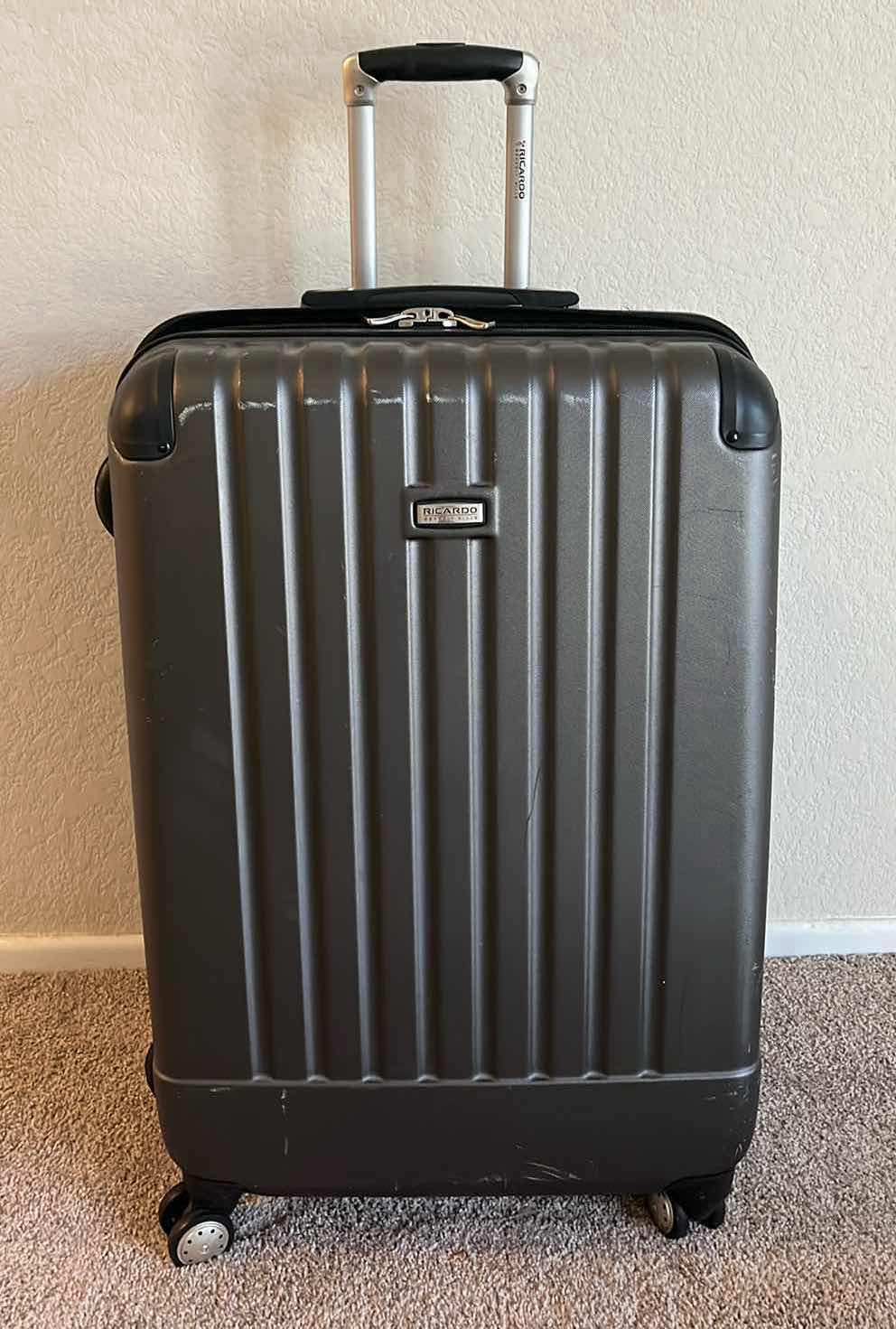 Photo 1 of RICARDO ROLLING LUGGAGE CHECK BAG W BOSS TRAVEL CARRYON BAG