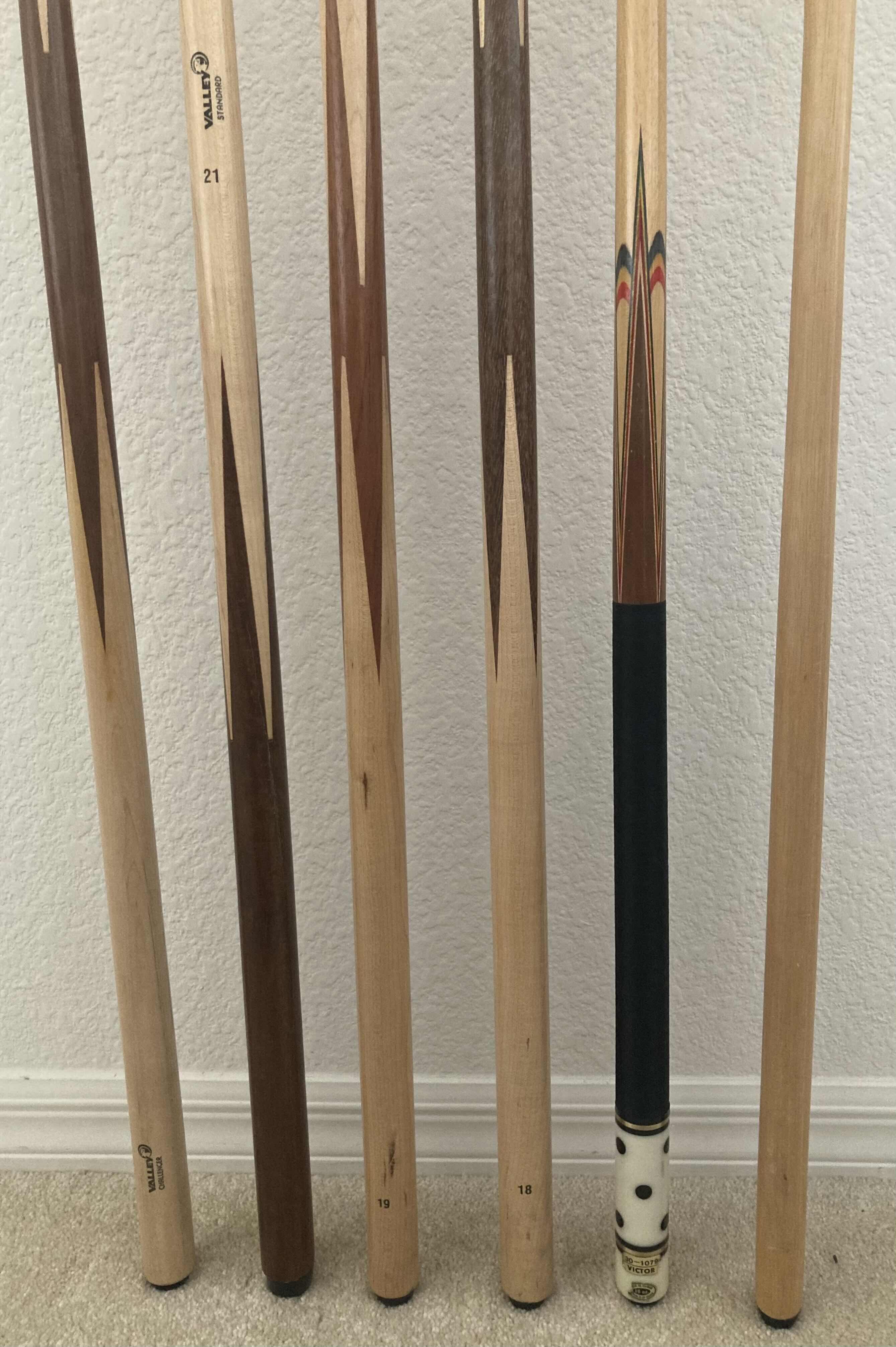 Photo 1 of POOL CUES & POOL CUE BRIDGE (6)