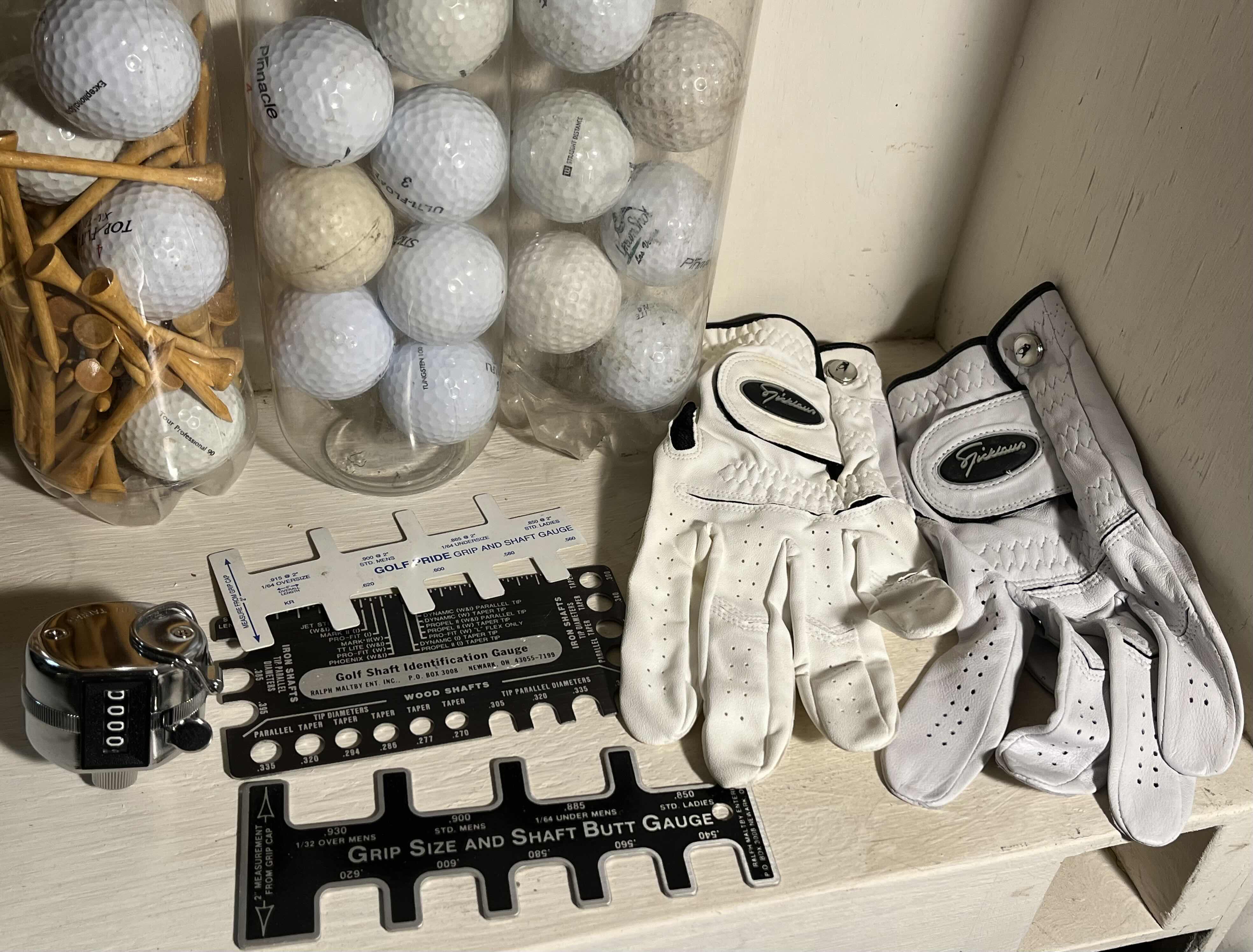 Photo 1 of GOLF ACCESSORIES-WOOD TEES, GOLF BALLS, COUNTER, GAUGES & GLOVES