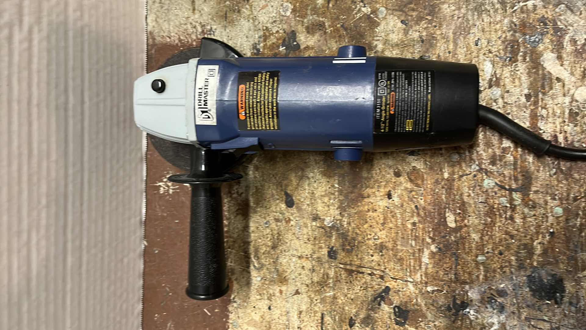Photo 1 of DRILL MASTER 4-1/2 ANGLE GRINDER MODEL 03150 W NEW GRINDING WHEELS