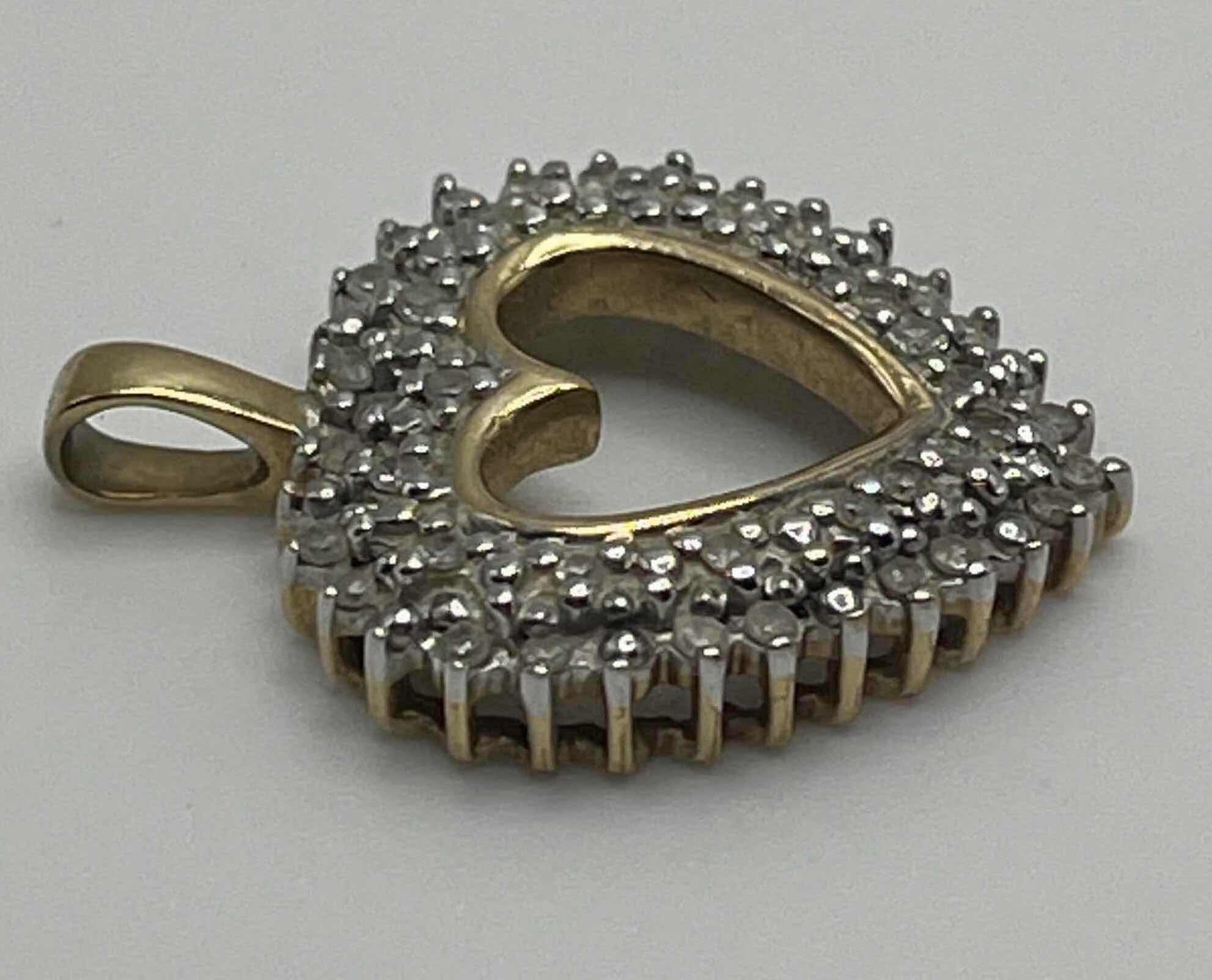 Photo 1 of DIAMOND CLUSTER GOLD 10K HEART PENDANT 3GRAMS