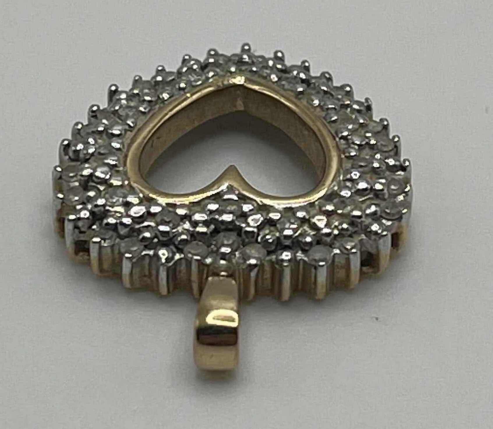 Photo 1 of DIAMOND CLUSTER GOLD 10K HEART PENDANT 3GRAMS