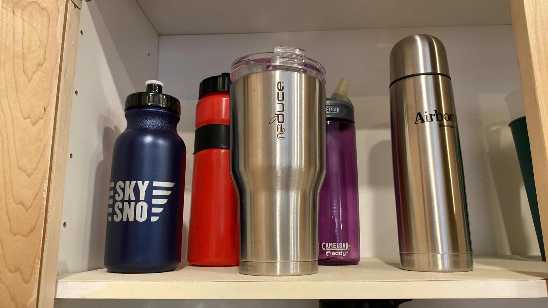 Photo 1 of CONTENTS OF SHELF VARIOUS SIZES BEVERAGE BOTTLES AND CUPS