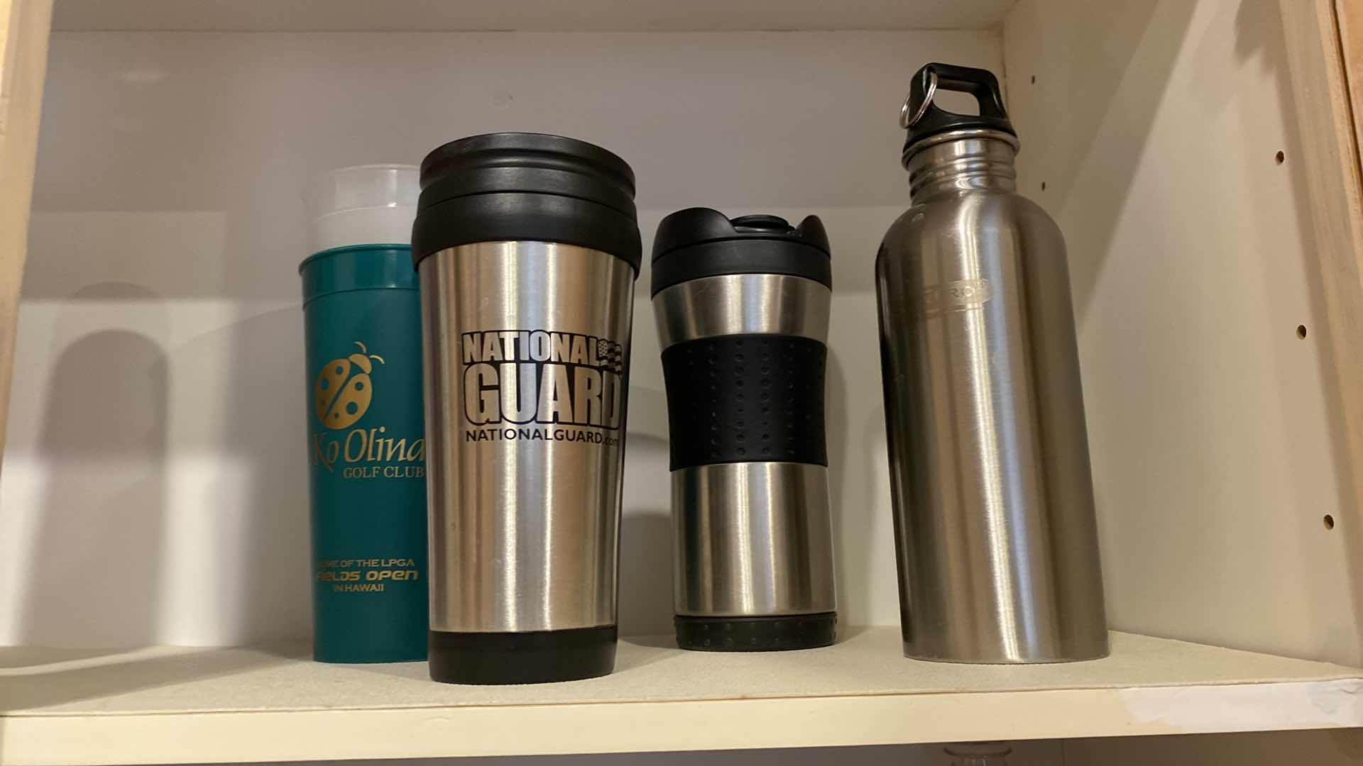 Photo 1 of CONTENTS OF SHELF VARIOUS SIZES BEVERAGE BOTTLES AND CUPS