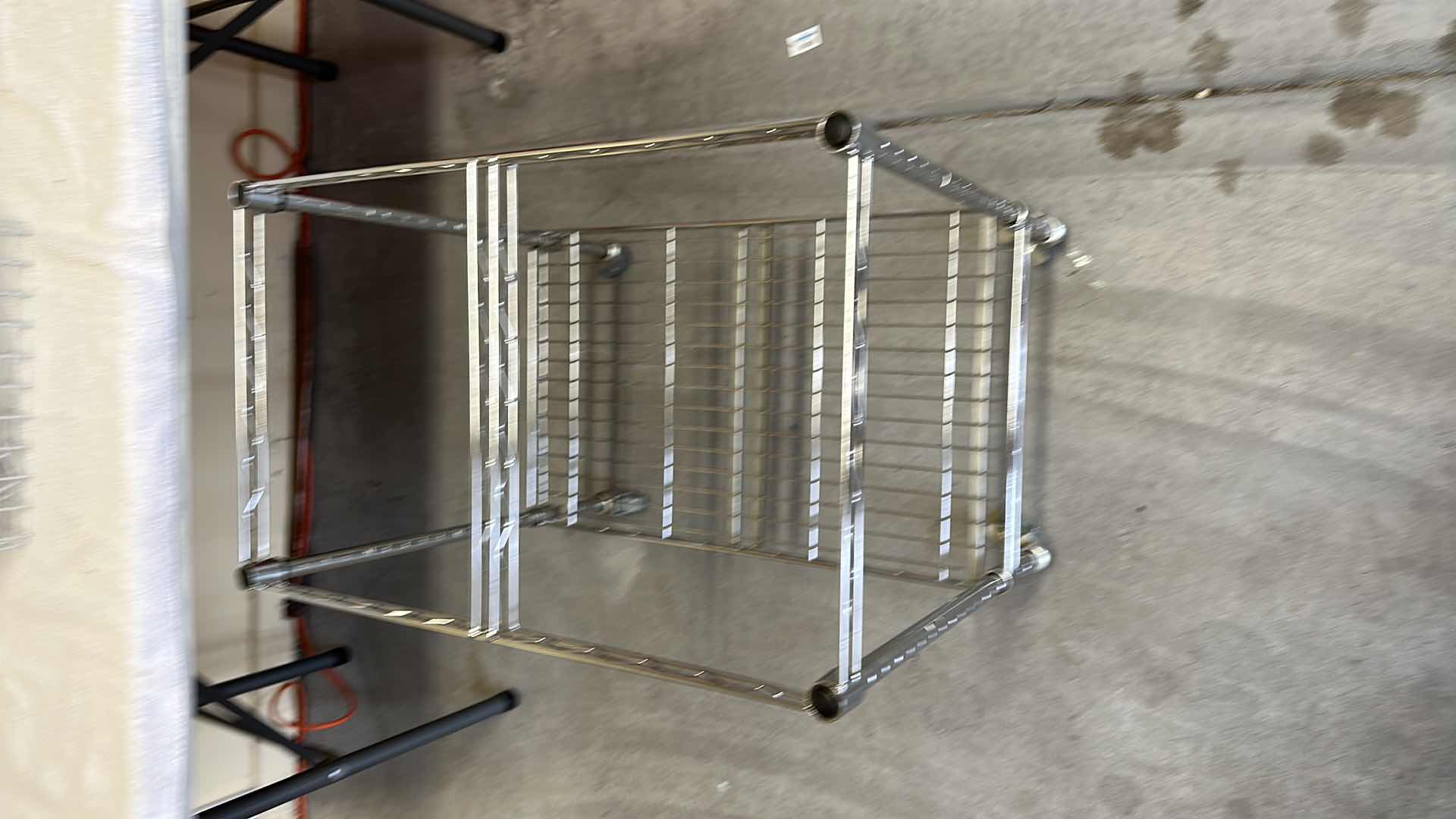 Photo 1 of METAL HANGING SHELVING UNIT,  ROLLING METAL  CART