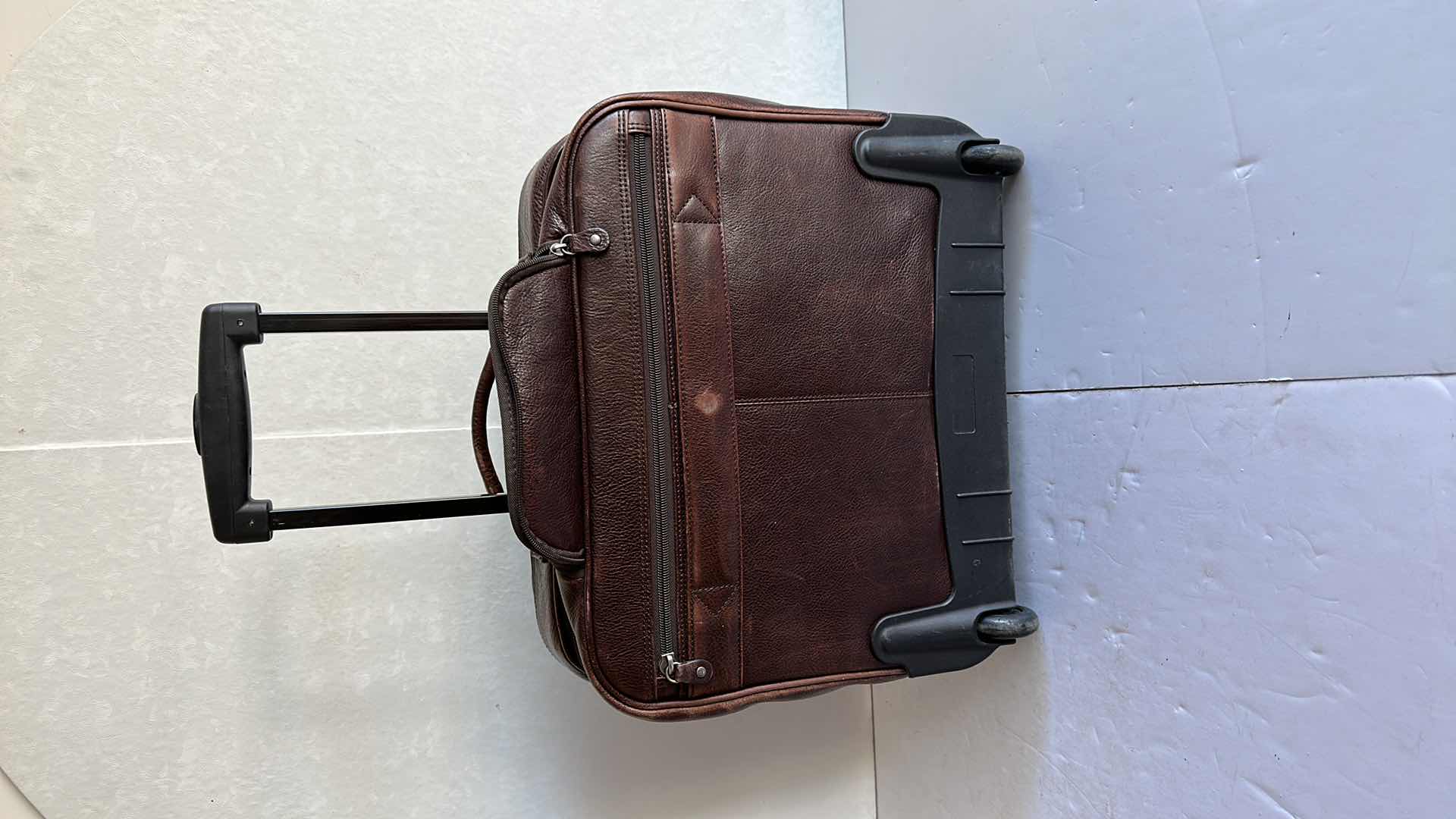 Photo 1 of WILSONS LEATHER SIX ZIPPED POCKETS BREIFCASE ON WHEELS AND HANDLE