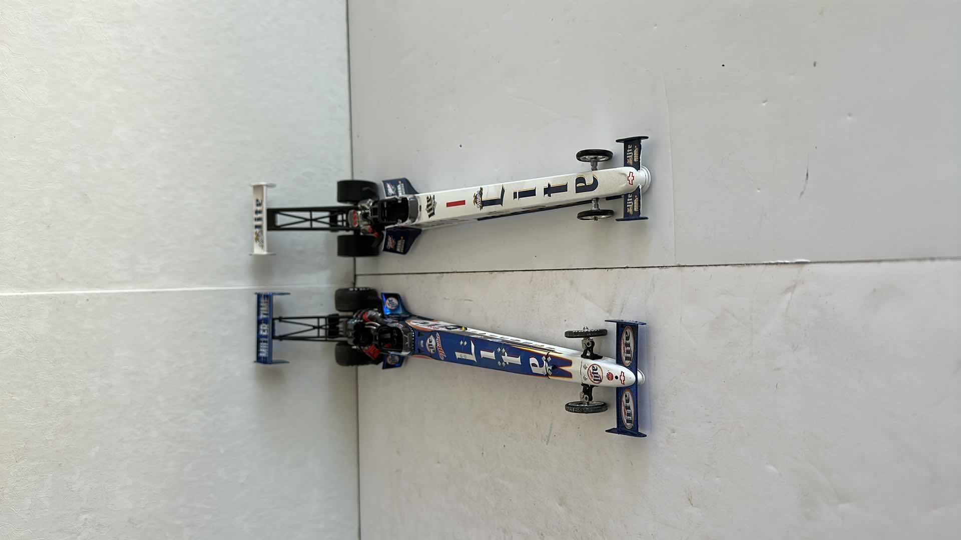 Photo 1 of TWO MILLER LITE DRAGSTERS 16”