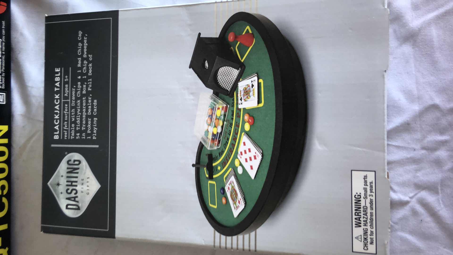 Photo 5 of ASSORTED ELECTRONICS PANASONIC CD CHANGER, BATTERY CHARGER, REMOTE SIGNAL SENDER, MINI BLACKJACK TABLE NEW IN BOX