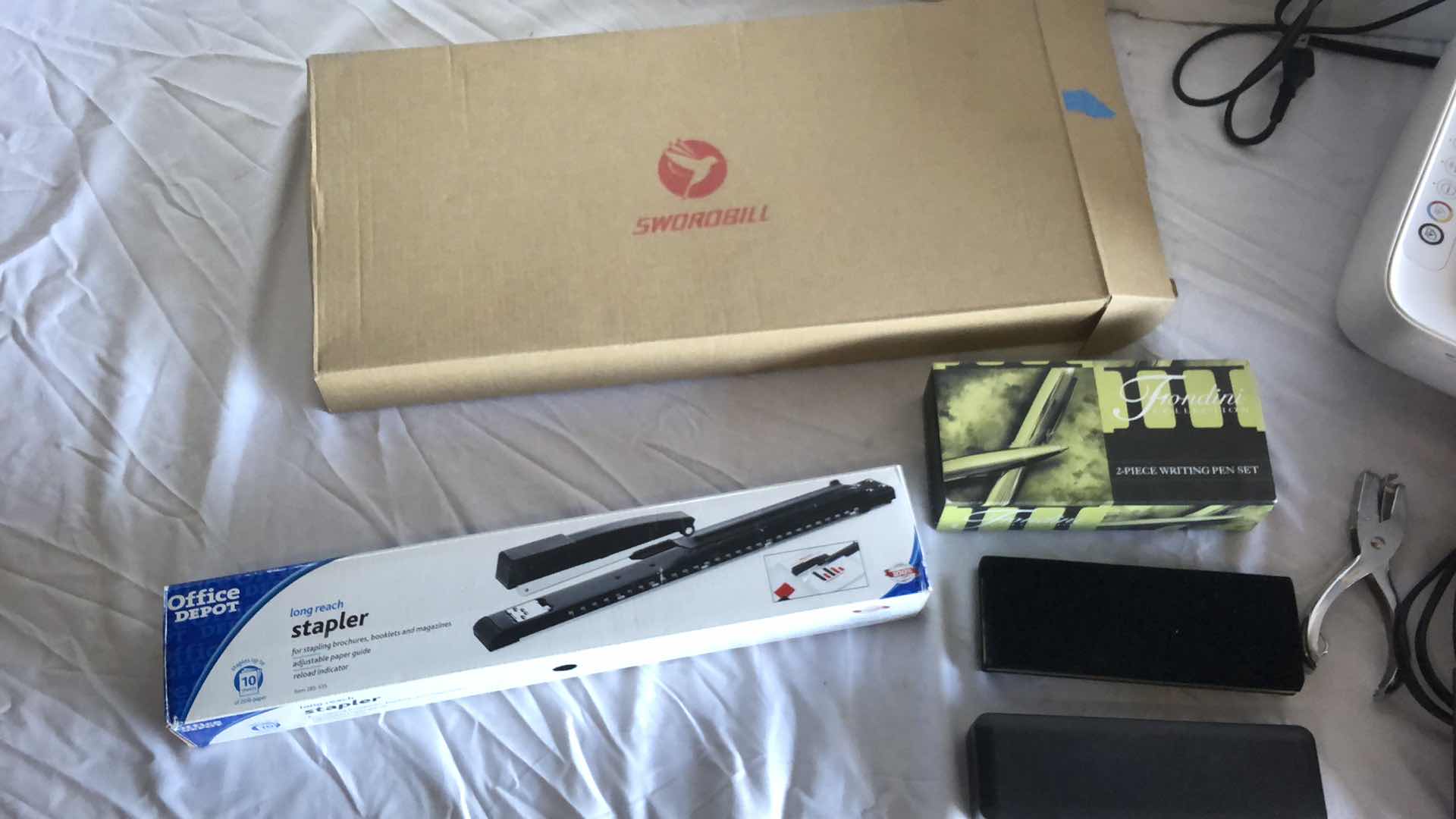 Photo 2 of OFFICE ASSORTMENT HP PRINTER, SWORDBILL WIRELESS KEYBOARD AND MOUSE, LONG STAPLER, CUSTOM PENS, ALARM CLOCK RADIOS