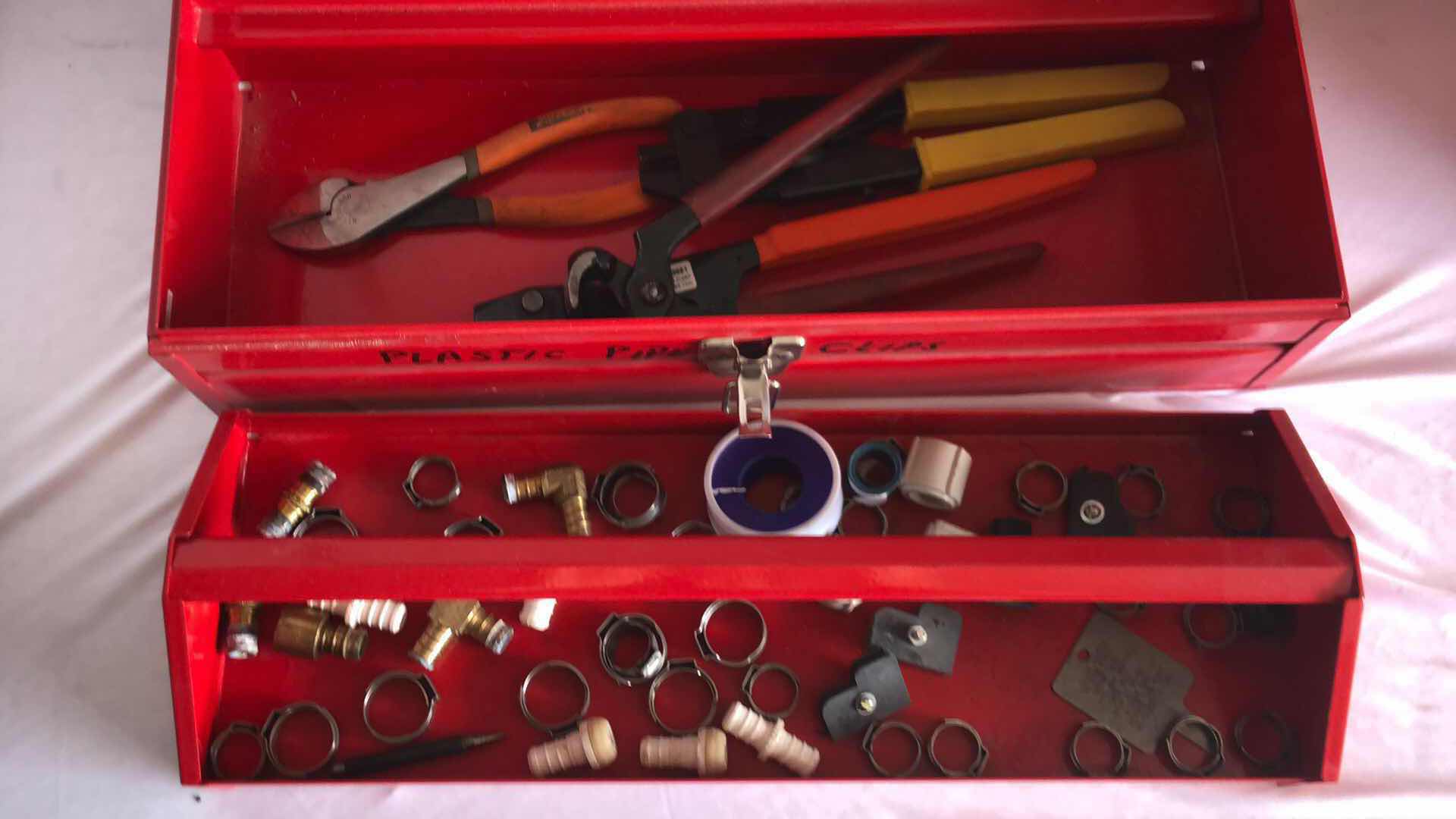 Photo 1 of VOYAGER 17” STEEL TOOLBOX W CRIMPING TOOLS AND STOREHOUSE STORAGE BIN FULL OF WALL ANCHORS