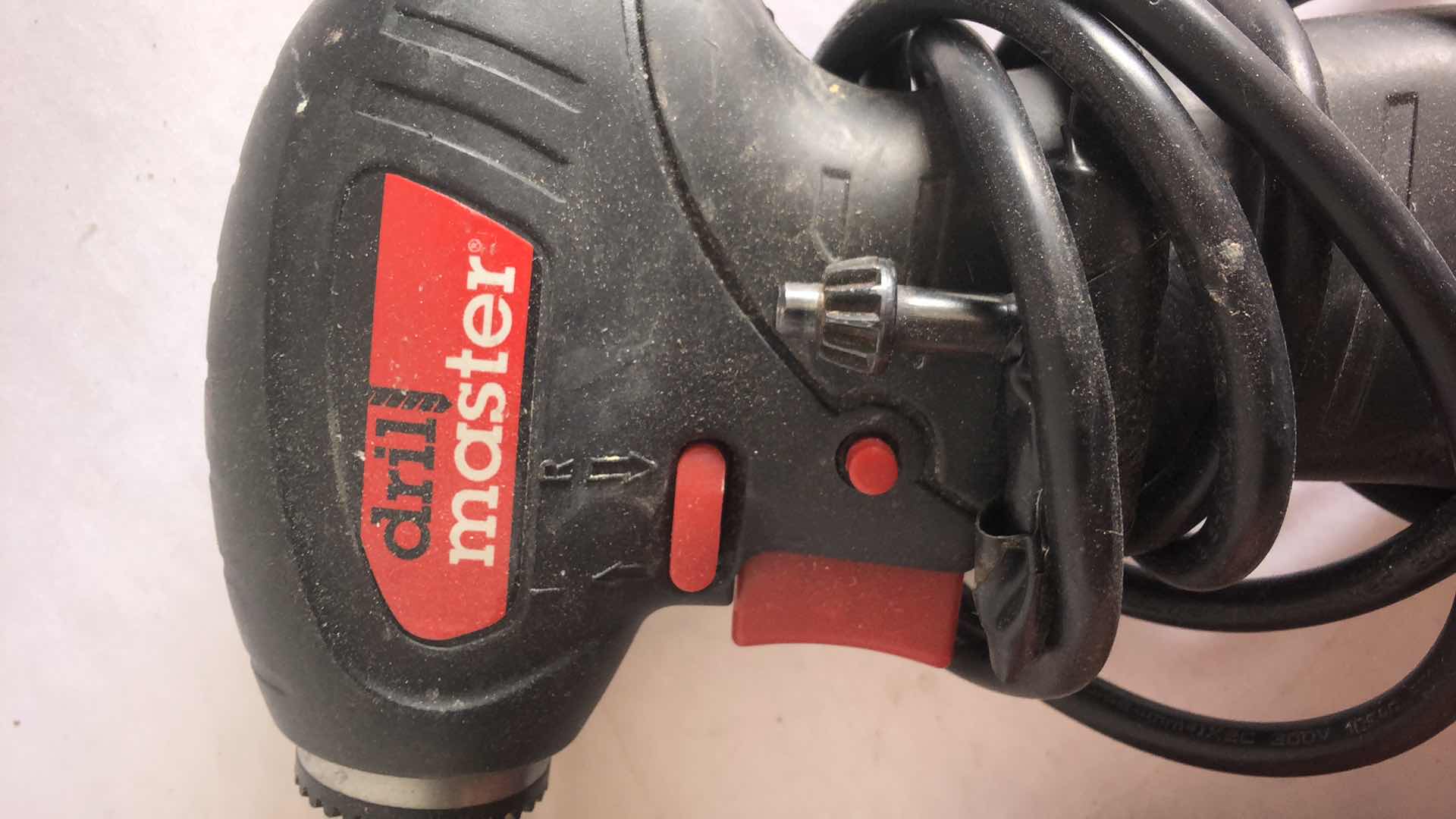 Photo 1 of DRILL MASTER CLOSE QUARTER DRILL AND CHICAGO ELECTRIC 4” HANDHELD TILE SAW (2)