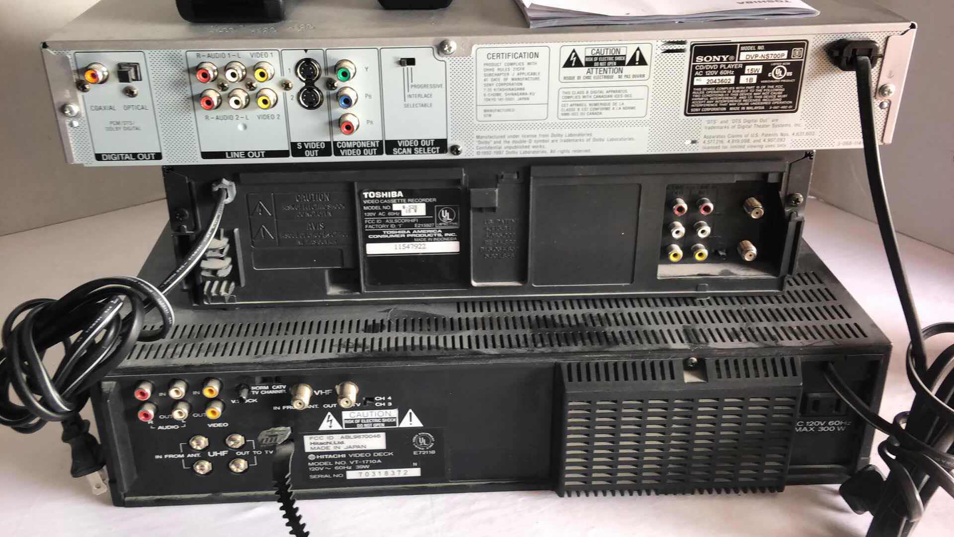 Photo 1 of SONY DVD CD VIDEO PLAYER, TOSHIBA 4 HEAD HIFI VHS PLAYER AND HITACHI 3+2 HEAD HIFI VHS PLAYER W REMOTES (3)
