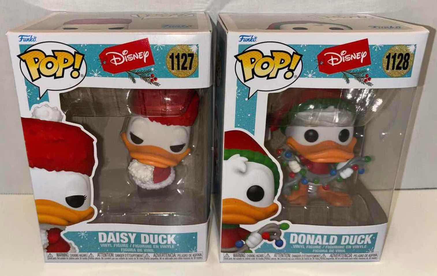 Photo 1 of NEW FUNKO POP! 2021 DISNEY HOLIDAY VINYL FIGURE 2-PACK, #1127 DAISY DUCK & #1128 DONALD DUCK