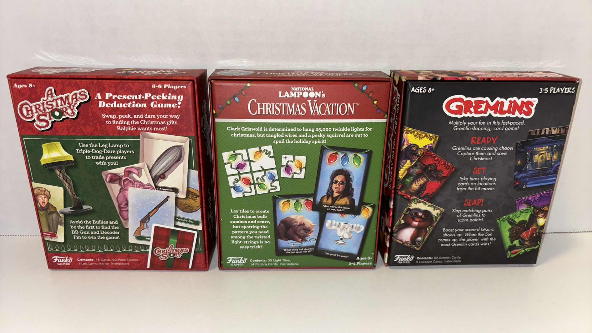 Photo 1 of FUNKO CARD GAMES, A CHRISTMAS STORY A MAJOR CARD GAME, NATIONAL LAMPOONS CHRISTMAS VACATION TWINKLING LIGHTS GAME, GREMLINS HOLIDAY HAVOC CARD GAME (3)