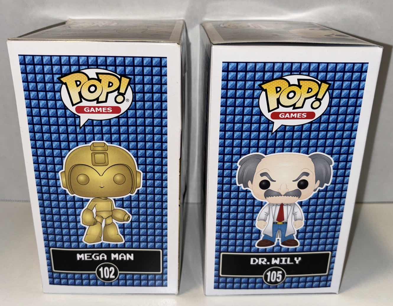 Photo 1 of NEW FUNKO POP! GAMES VINYL FIGURE, MEGAMAN 2-PACK GAMESTOP EXCLUSIVE #102 GOLD MEGA MAN ($75) & #105 DR. WILY ($12)
