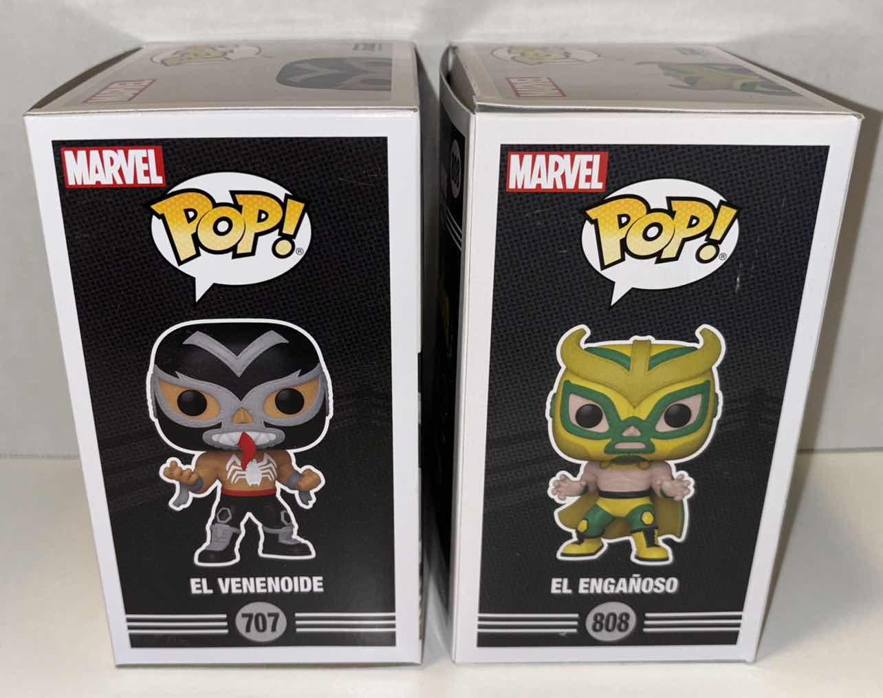Photo 1 of NEW FUNKO POP! BOBBLEHEAD-HEAD VINYL FIGURE, 2-PACK MARVEL LUCHA LIBRE EDITION #707 EL VENENOIDE & #808 EL ENGANOSO