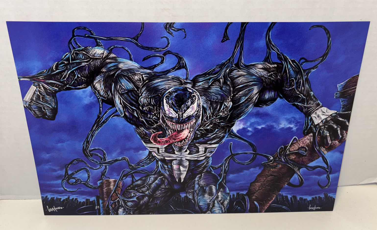 Photo 1 of VICTOR GARDUNO “VENOMOUS” 11” X 17” INFINITY GLOSS UNFRAMED PRINT W EMBOSSED SEAL, DIGITAL SIGNATURE & OFFICIAL SIGNATURE W COA INCLUDED, STORED IN A RIGID PRINT PROTECTOR SLEEVE