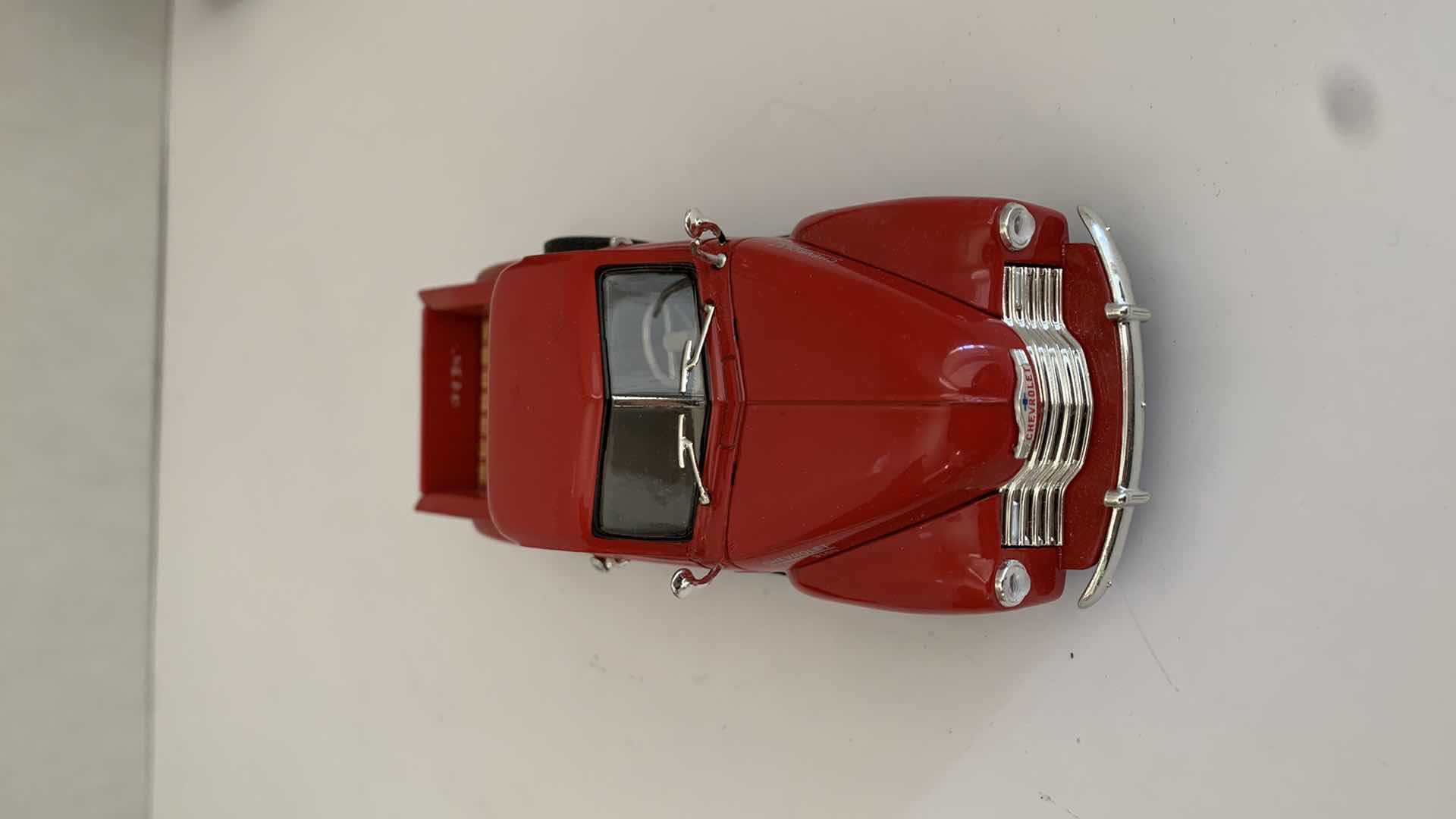 Photo 1 of SET OF 4 DIE CAST METAL FORD AND CHEVORLET TRUCKS 6” X 2” H 3”