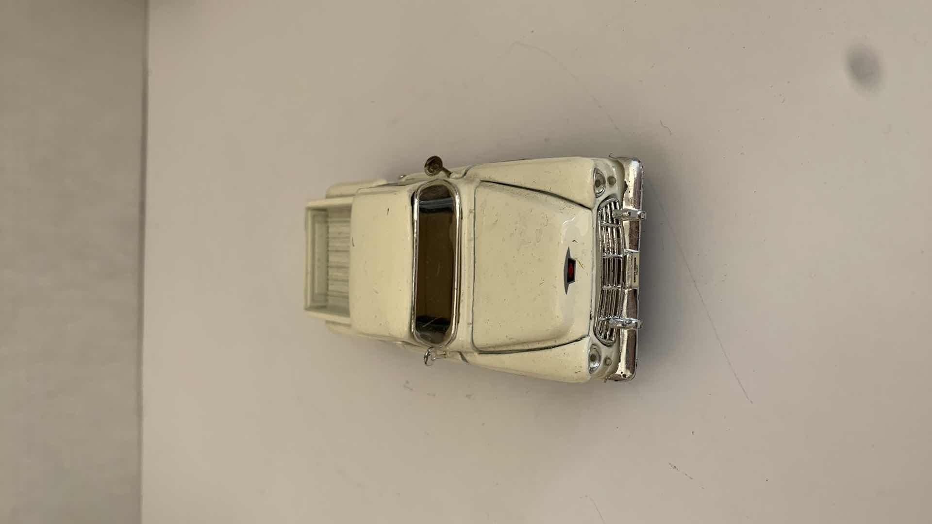 Photo 1 of SET OF 4 DIE CAST METAL FORD AND CHEVORLET TRUCKS 6” X 2” H 3”