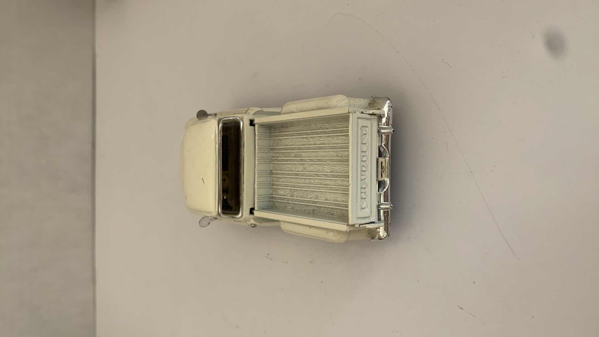 Photo 1 of SET OF 4 DIE CAST METAL FORD AND CHEVORLET TRUCKS 6” X 2” H 3”