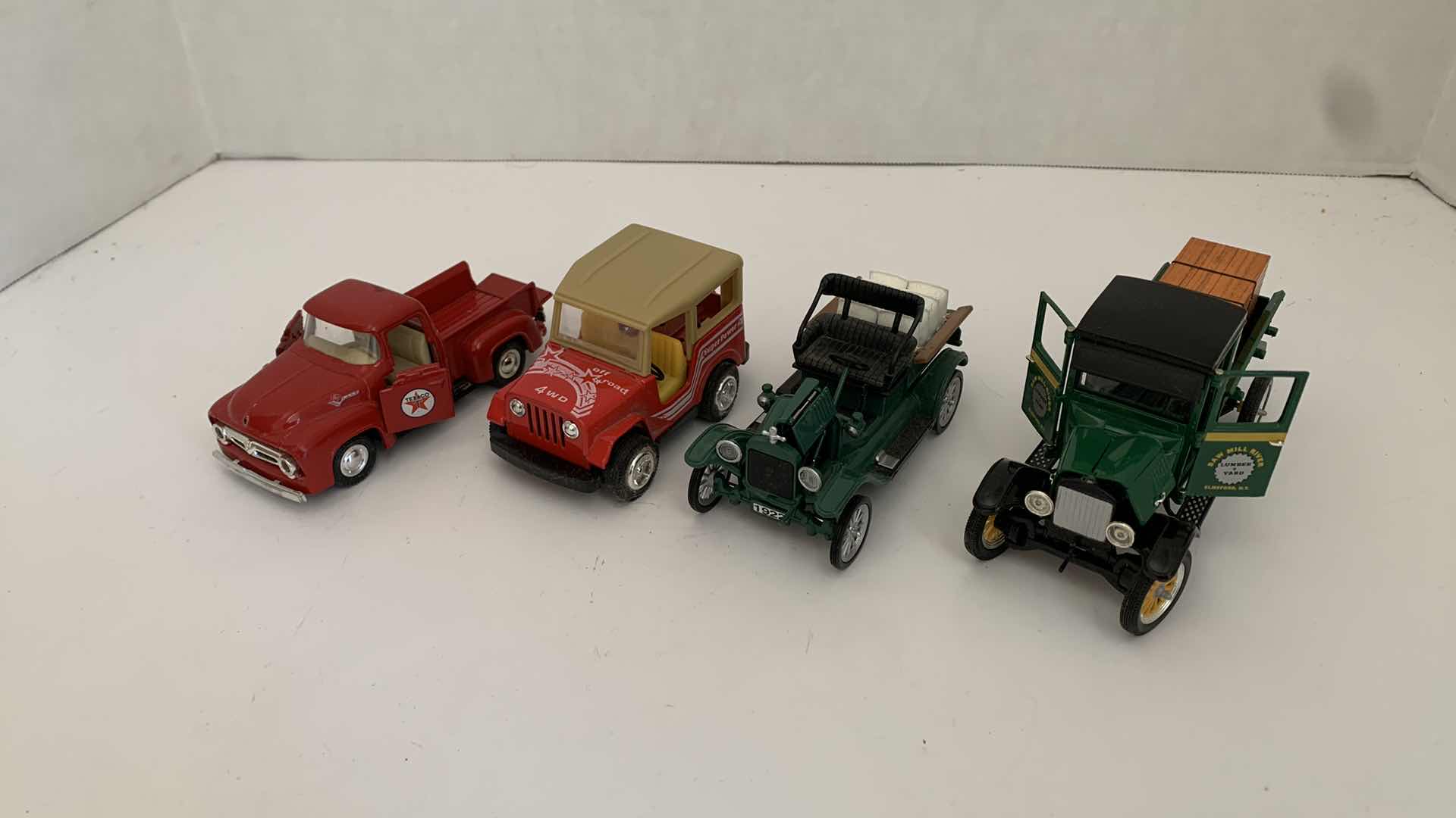 Photo 1 of SET OF 4 DIE CAST METAL TRUCKS, LARGEST 6” X 2” H 3”