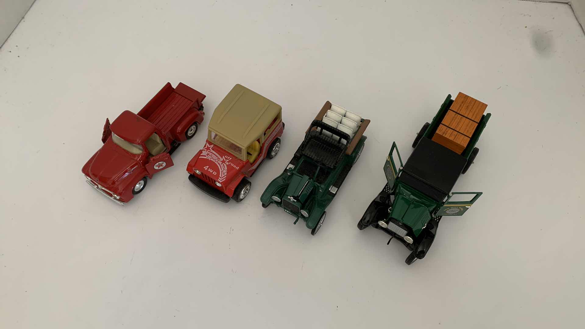 Photo 1 of SET OF 4 DIE CAST METAL TRUCKS, LARGEST 6” X 2” H 3”