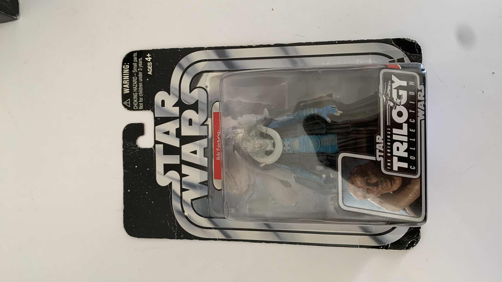 Photo 1 of SET OF 4 STAR WARS FIGURES IN BOX