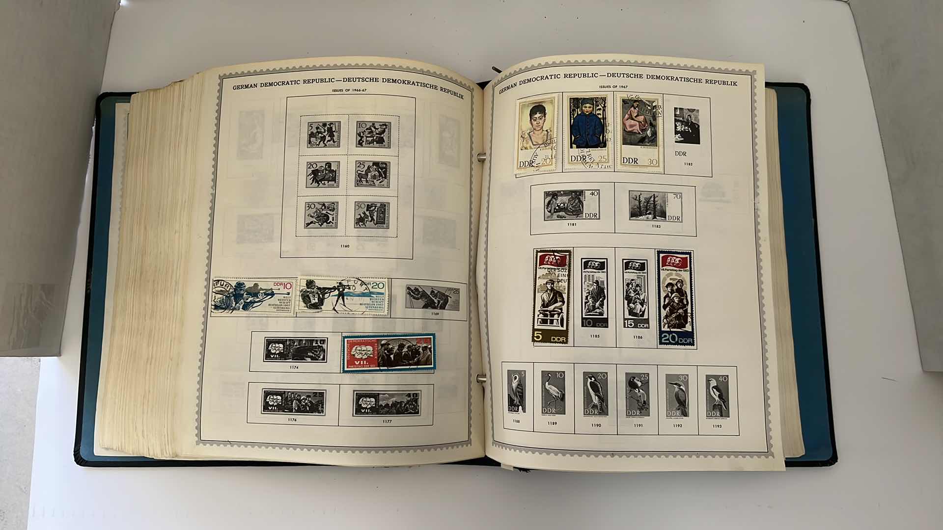 Photo 1 of GLOBAL STAMP ALBUM CONTAINING VINTAGE STAMPS